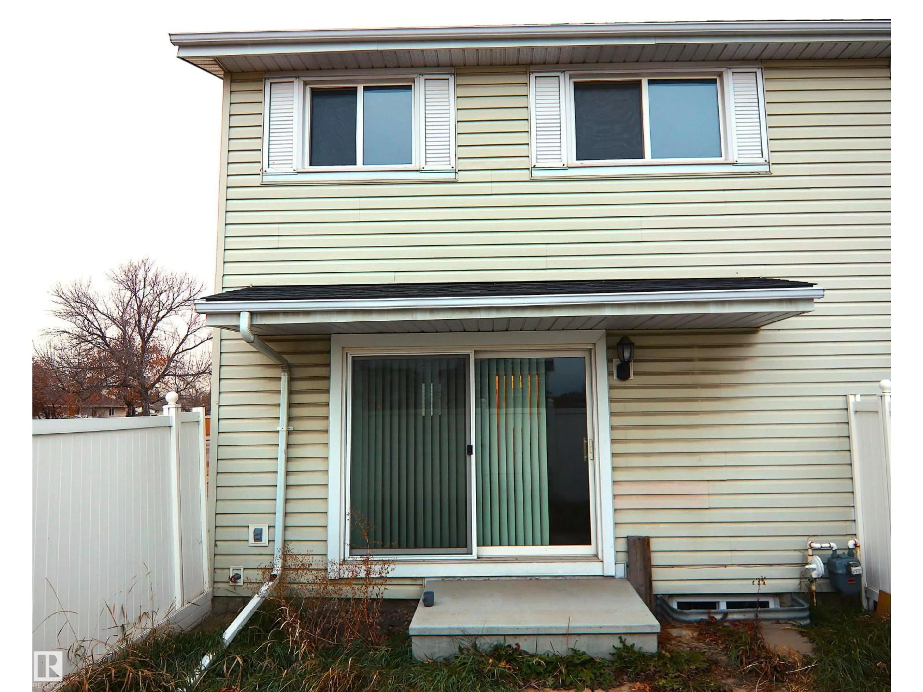 Home with vinyl exterior material, street for NW - 11350 139 AV, Edmonton Alberta T5Y2N3