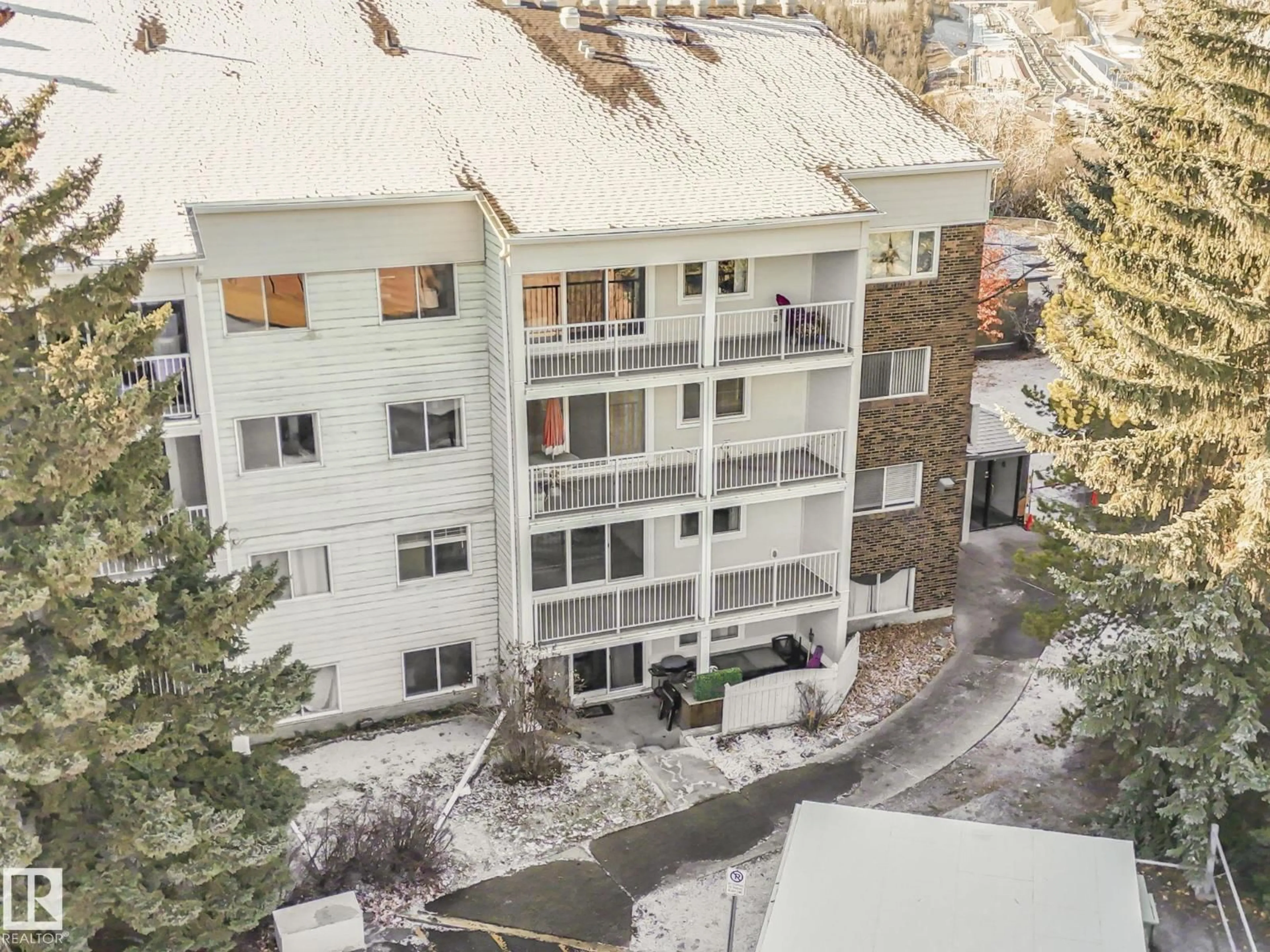 A pic from outside/outdoor area/front of a property/back of a property/a pic from drone, unknown for #201 - 4404 122 ST, Edmonton Alberta T6J4A9