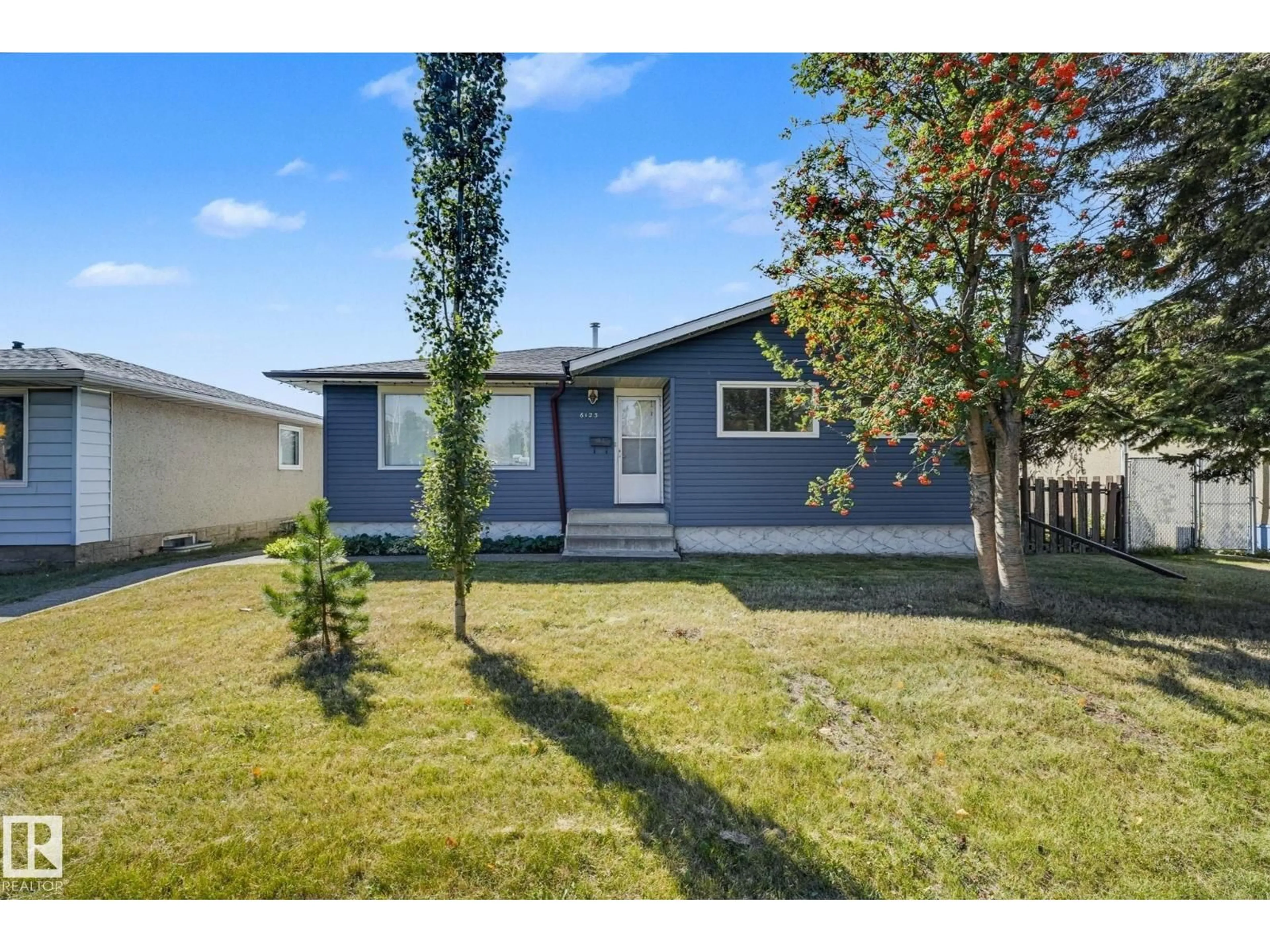 Home with vinyl exterior material, street for 6123 144 AV, Edmonton Alberta T5A1K8