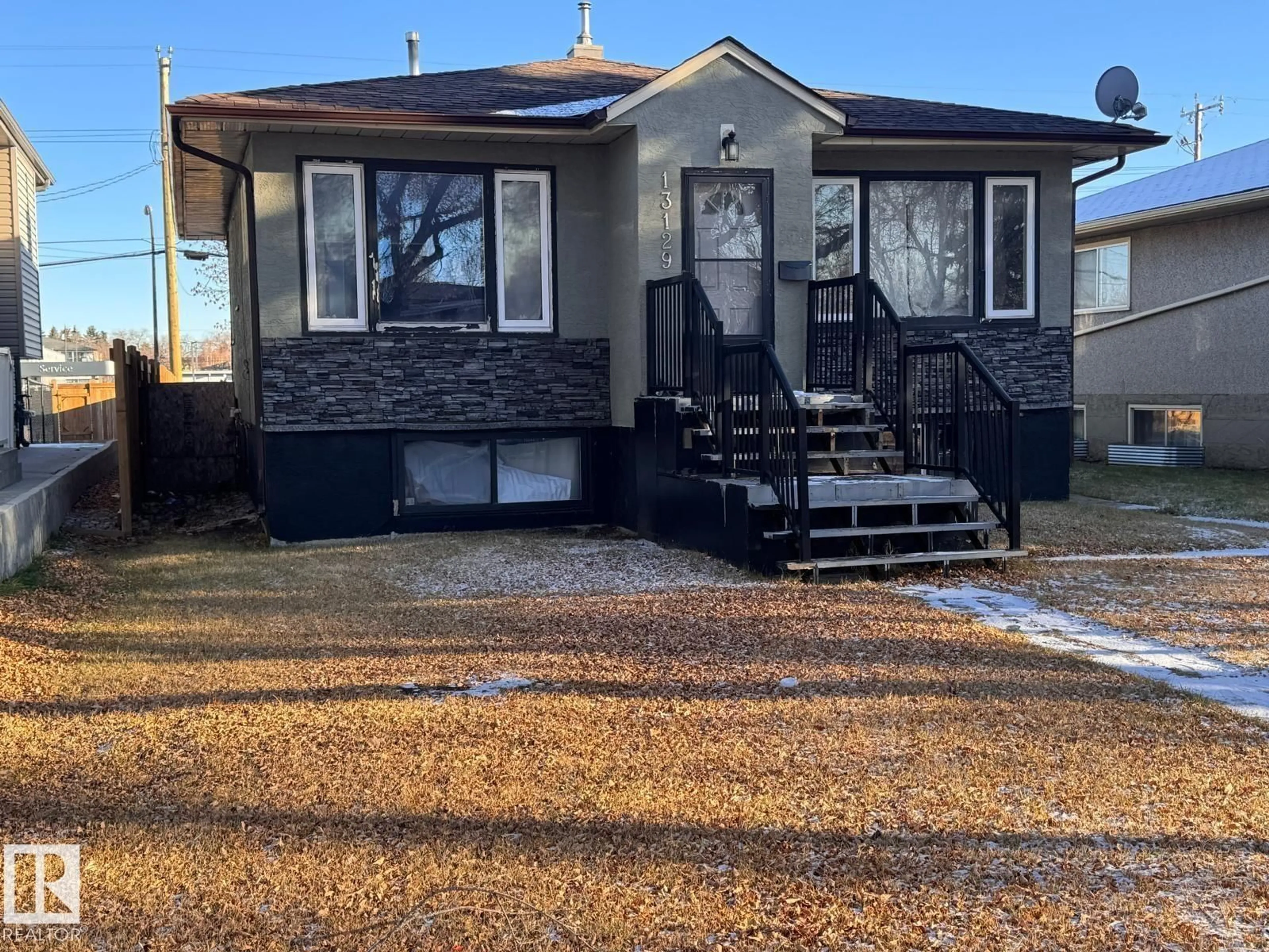 Home with vinyl exterior material, street for 13129 101 ST, Edmonton Alberta T5E4G1