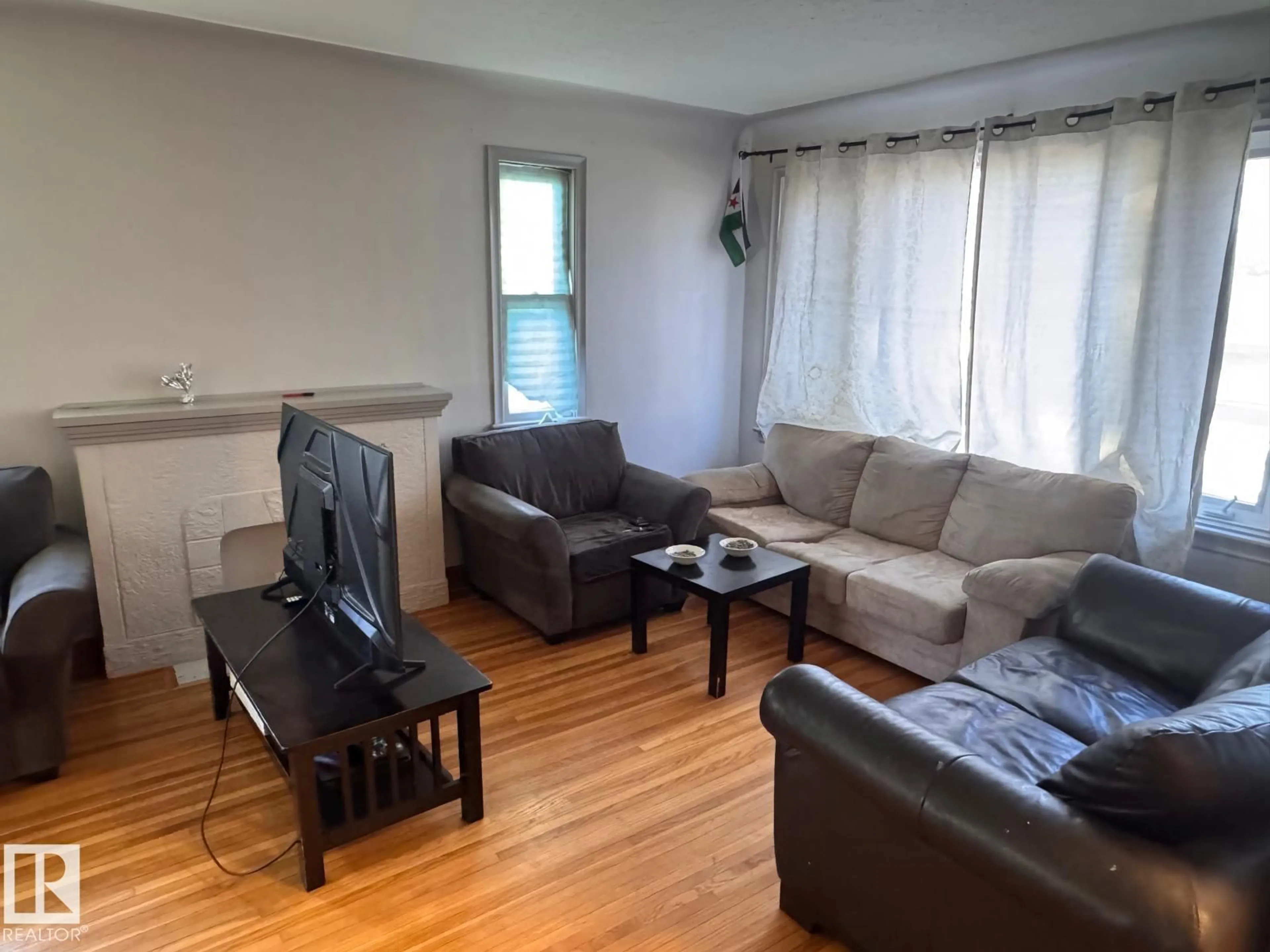 Living room with furniture, wood/laminate floor for 13129 101 ST, Edmonton Alberta T5E4G1