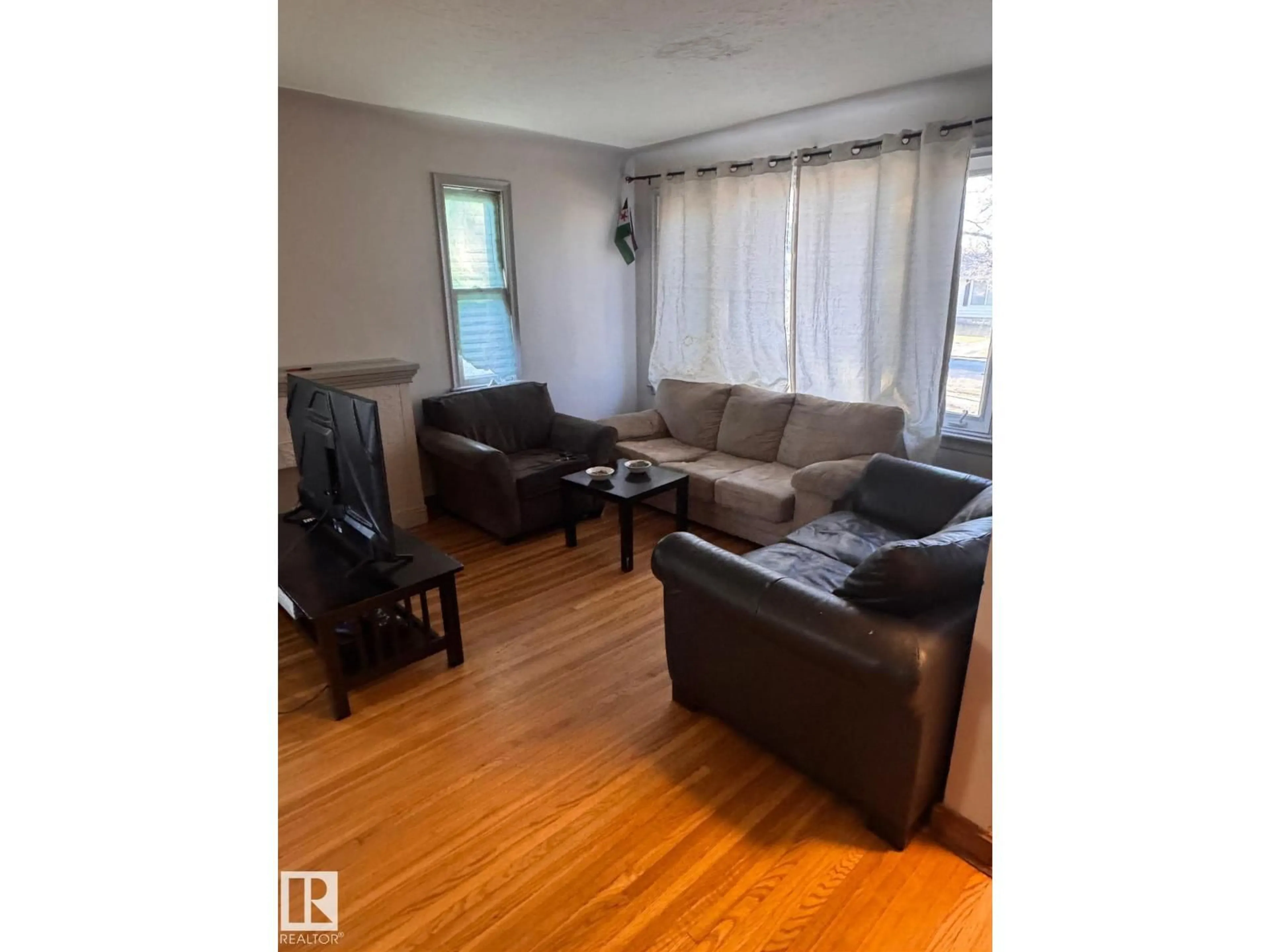 Living room with furniture, wood/laminate floor for 13129 101 ST, Edmonton Alberta T5E4G1