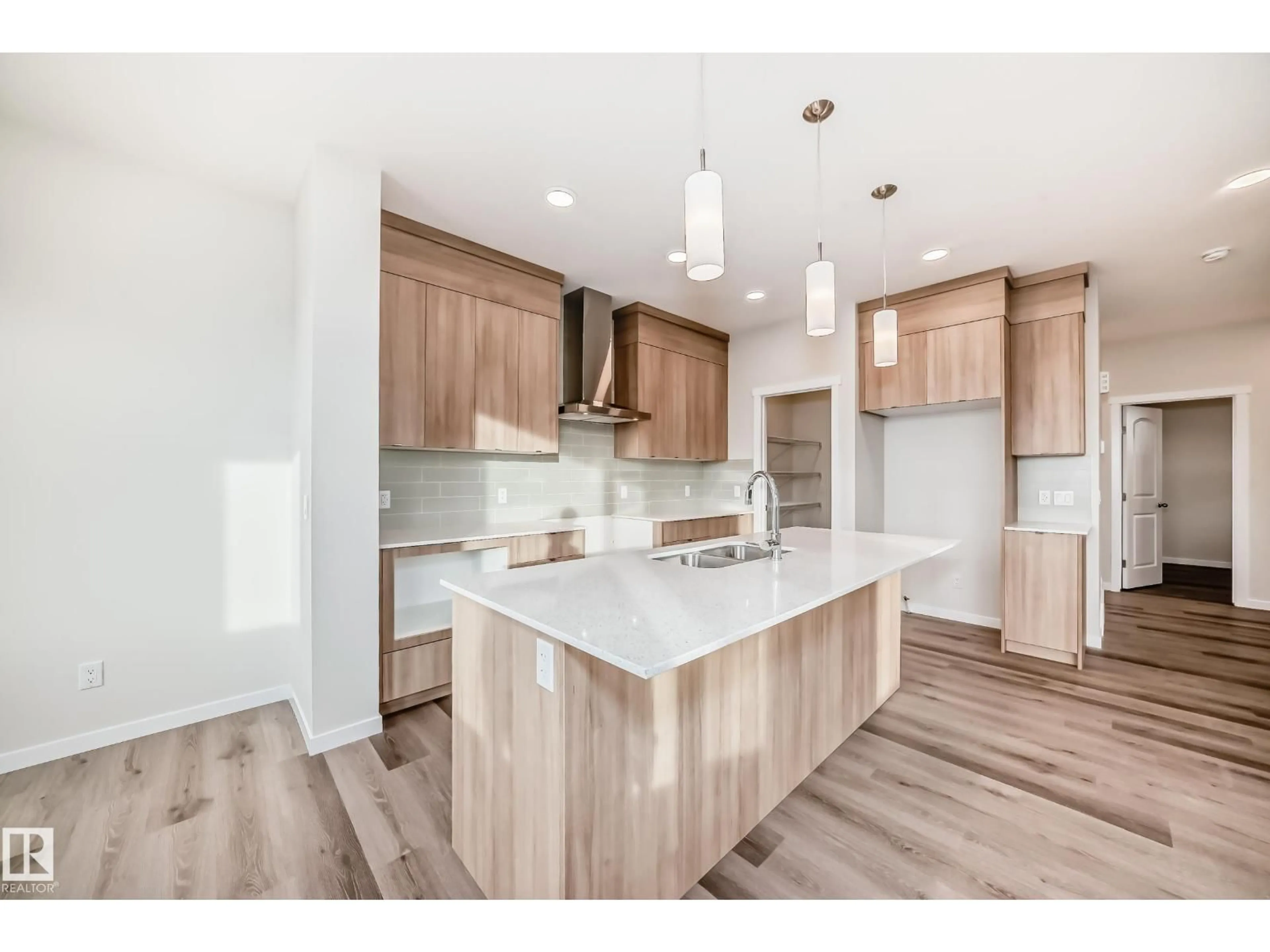 Open concept kitchen, wood/laminate floor for 2346 EGRET WY, Edmonton Alberta T6M3G8