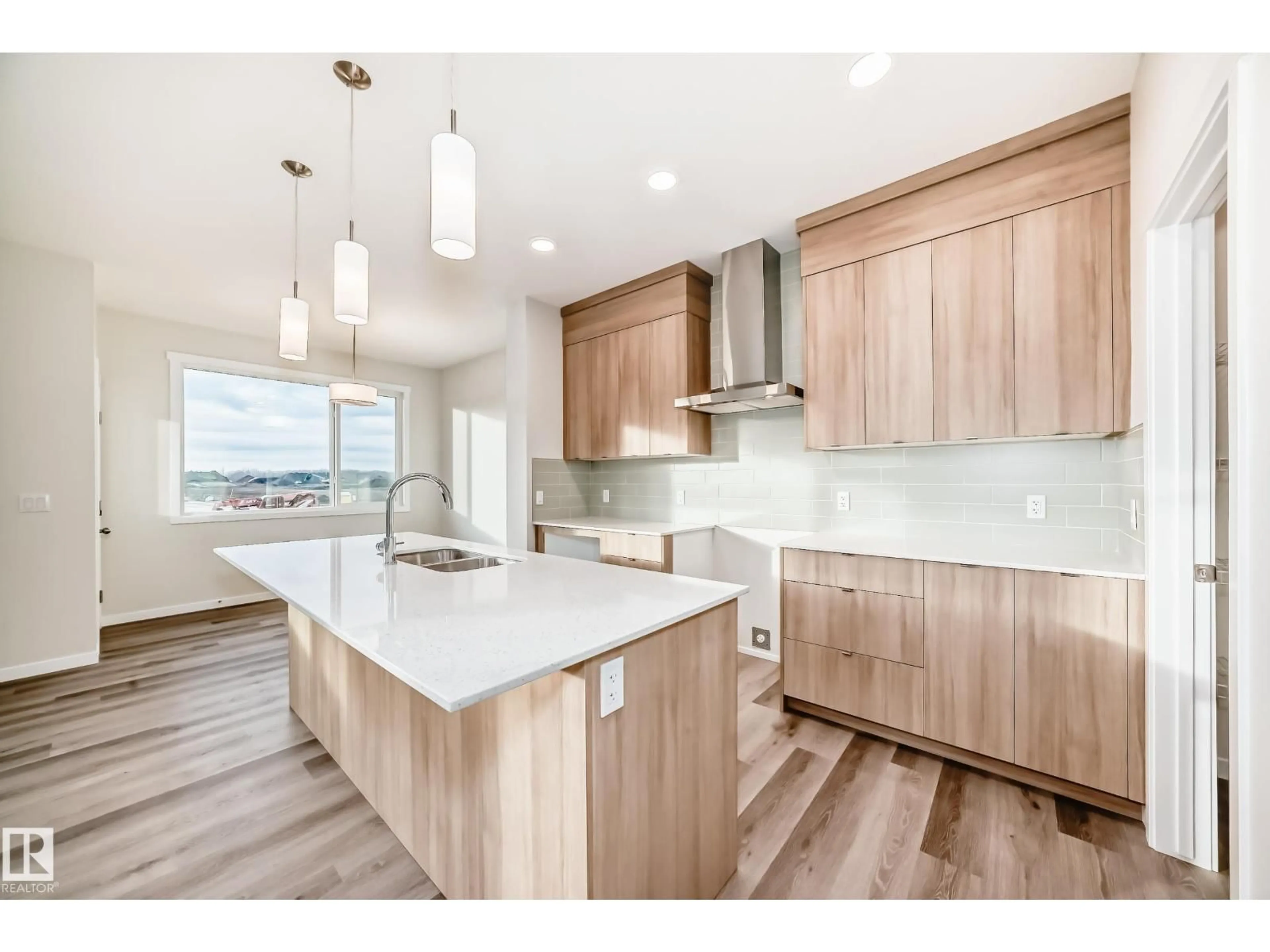 Open concept kitchen, wood/laminate floor for 2346 EGRET WY, Edmonton Alberta T6M3G8