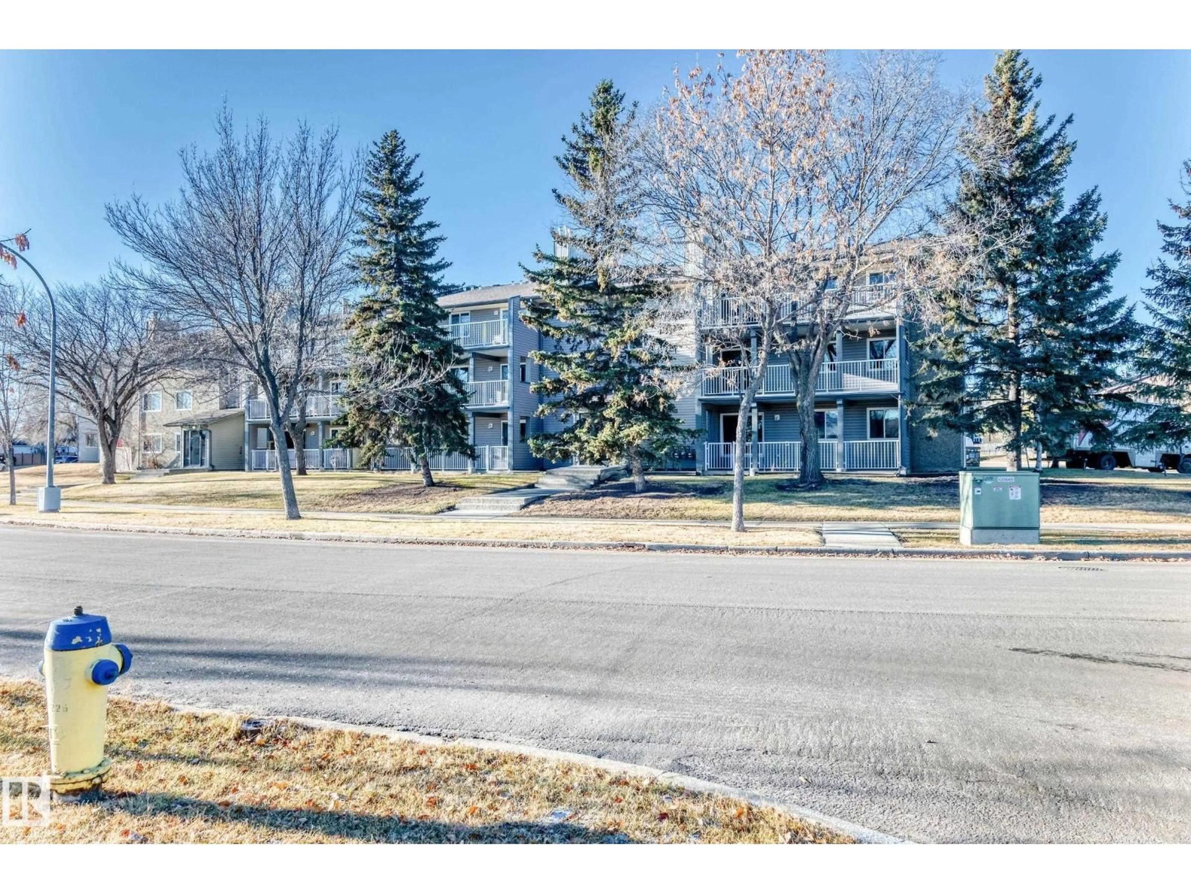 A pic from outside/outdoor area/front of a property/back of a property/a pic from drone, street for #106 - 6208 180 ST NW, Edmonton Alberta T5T2T2