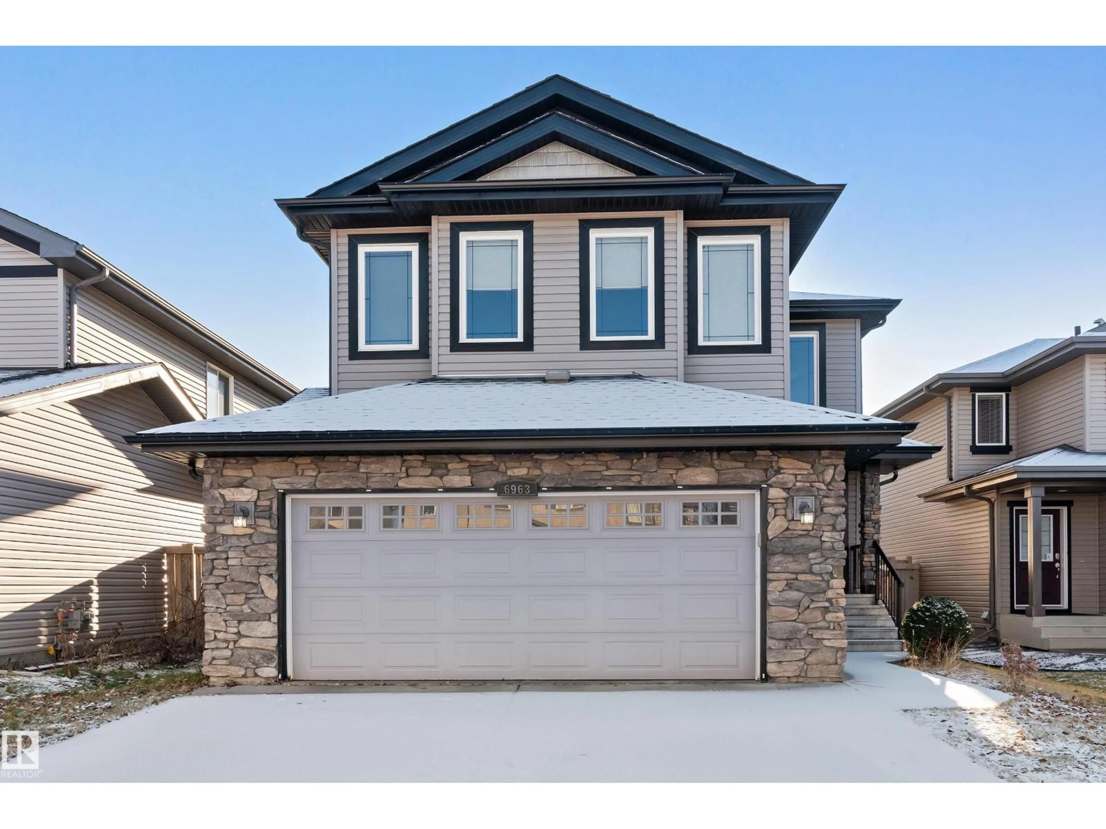 Home with vinyl exterior material, street for SW - 6963 19A AV, Edmonton Alberta T6X0L7