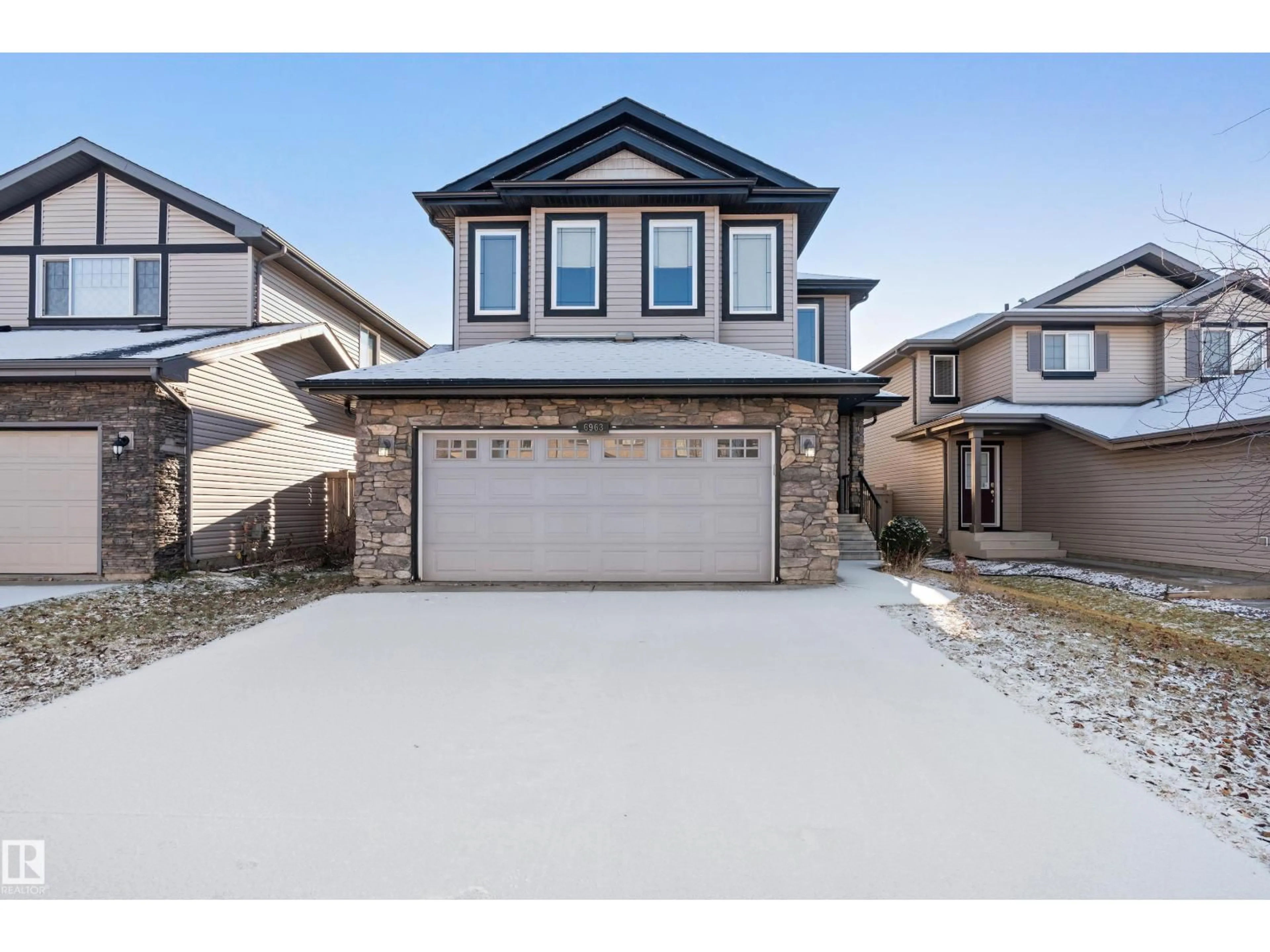 Home with vinyl exterior material, street for SW - 6963 19A AV, Edmonton Alberta T6X0L7