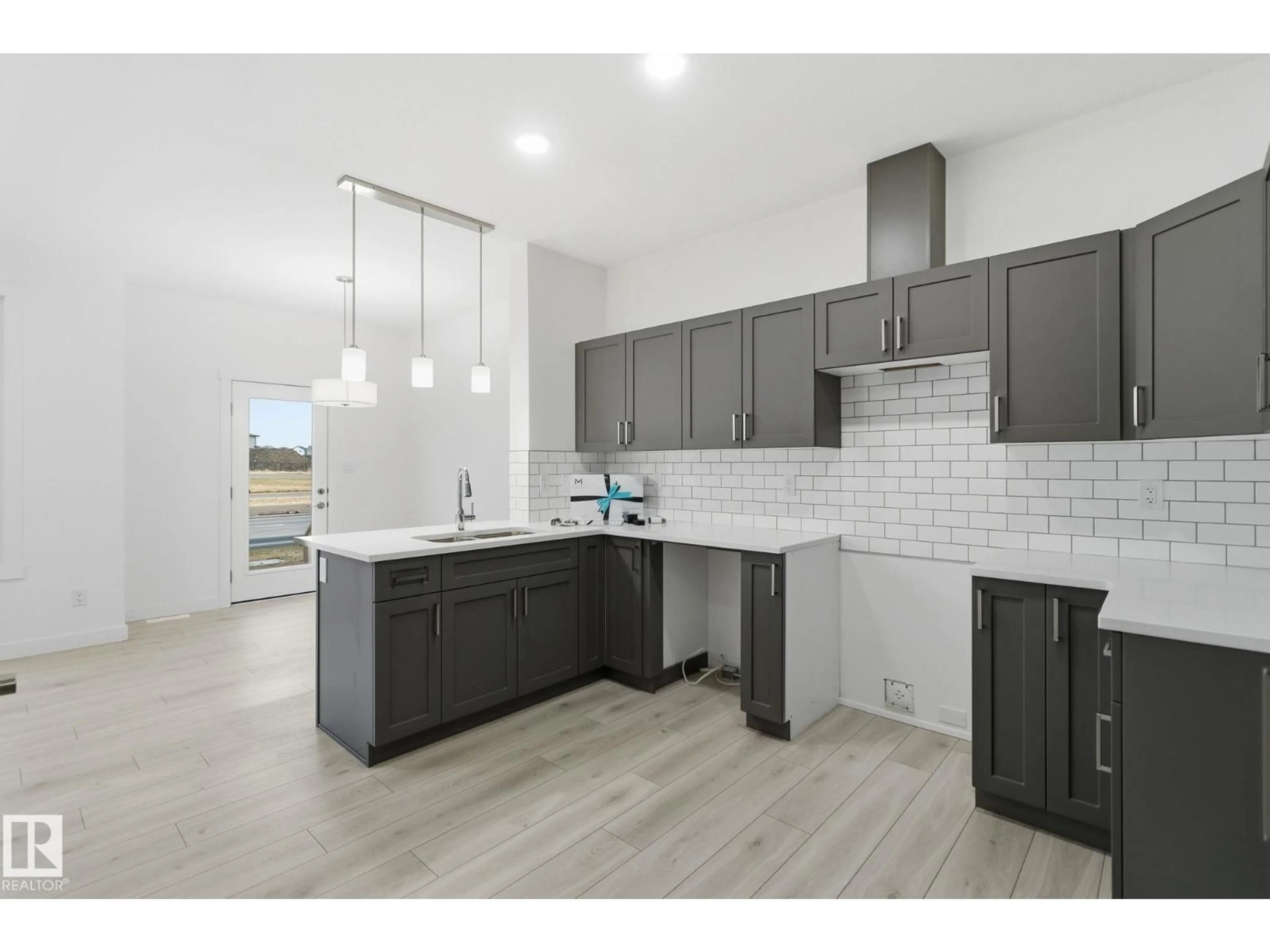 Open concept kitchen, unknown for #7 - 2710 66 ST, Edmonton Alberta T6X3H4