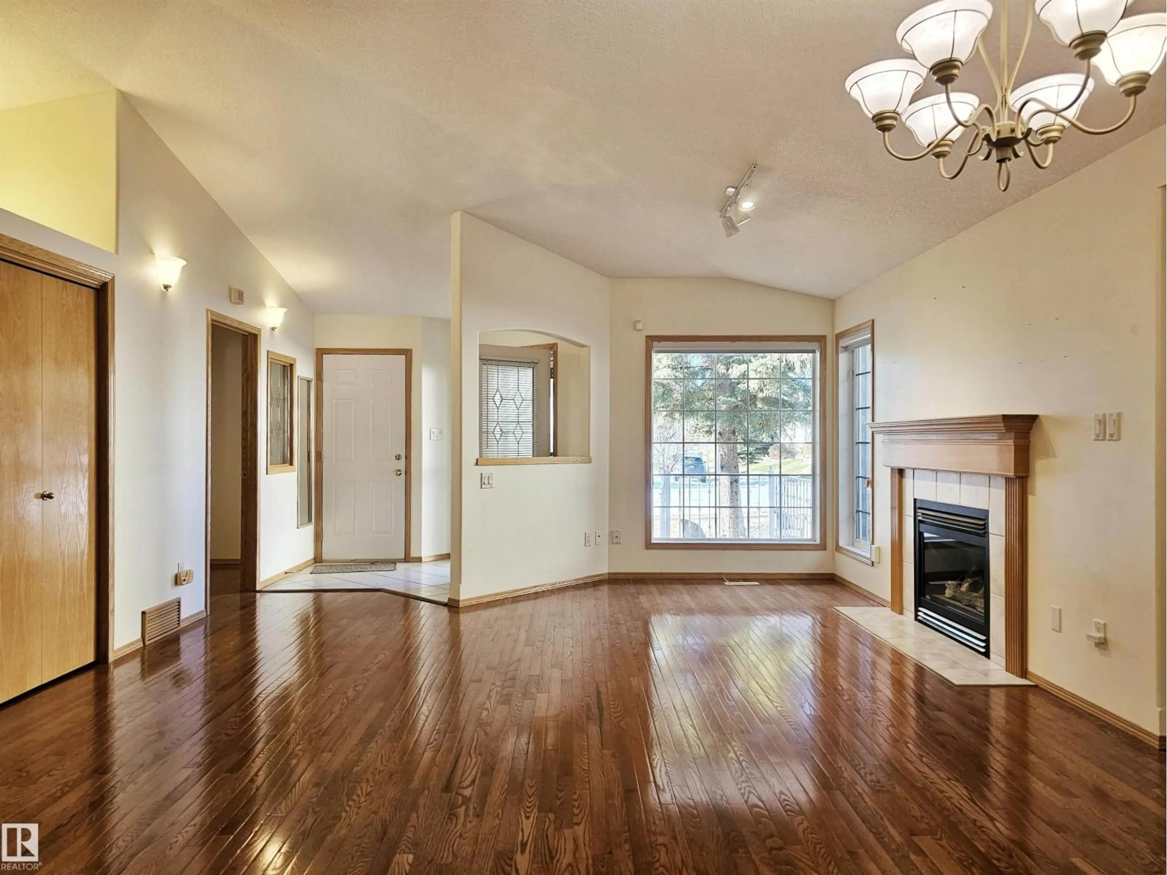 Living room with furniture, wood/laminate floor for 27 EDWARD WY, St. Albert Alberta T8N6Y1