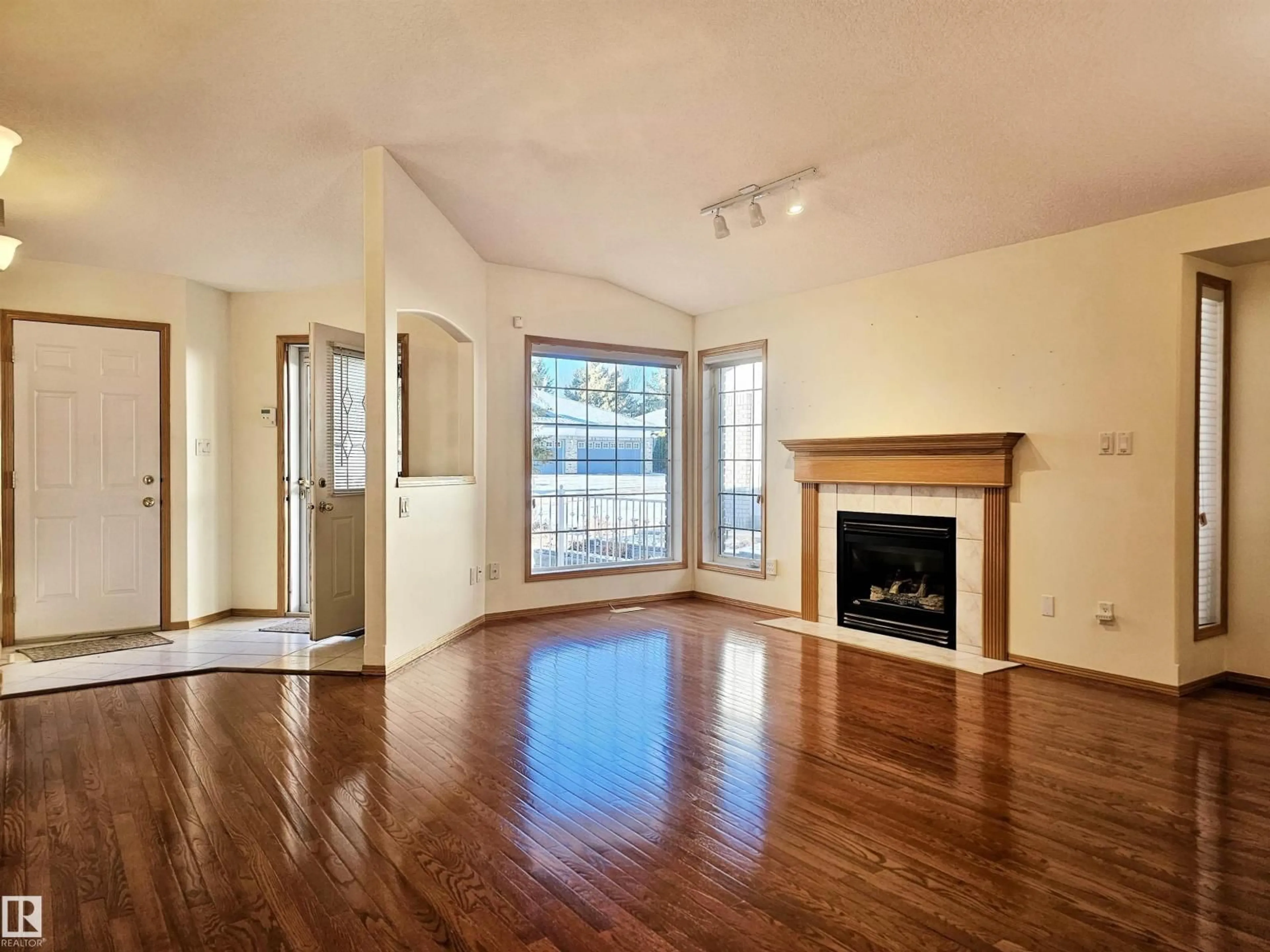 Living room with furniture, wood/laminate floor for 27 EDWARD WY, St. Albert Alberta T8N6Y1