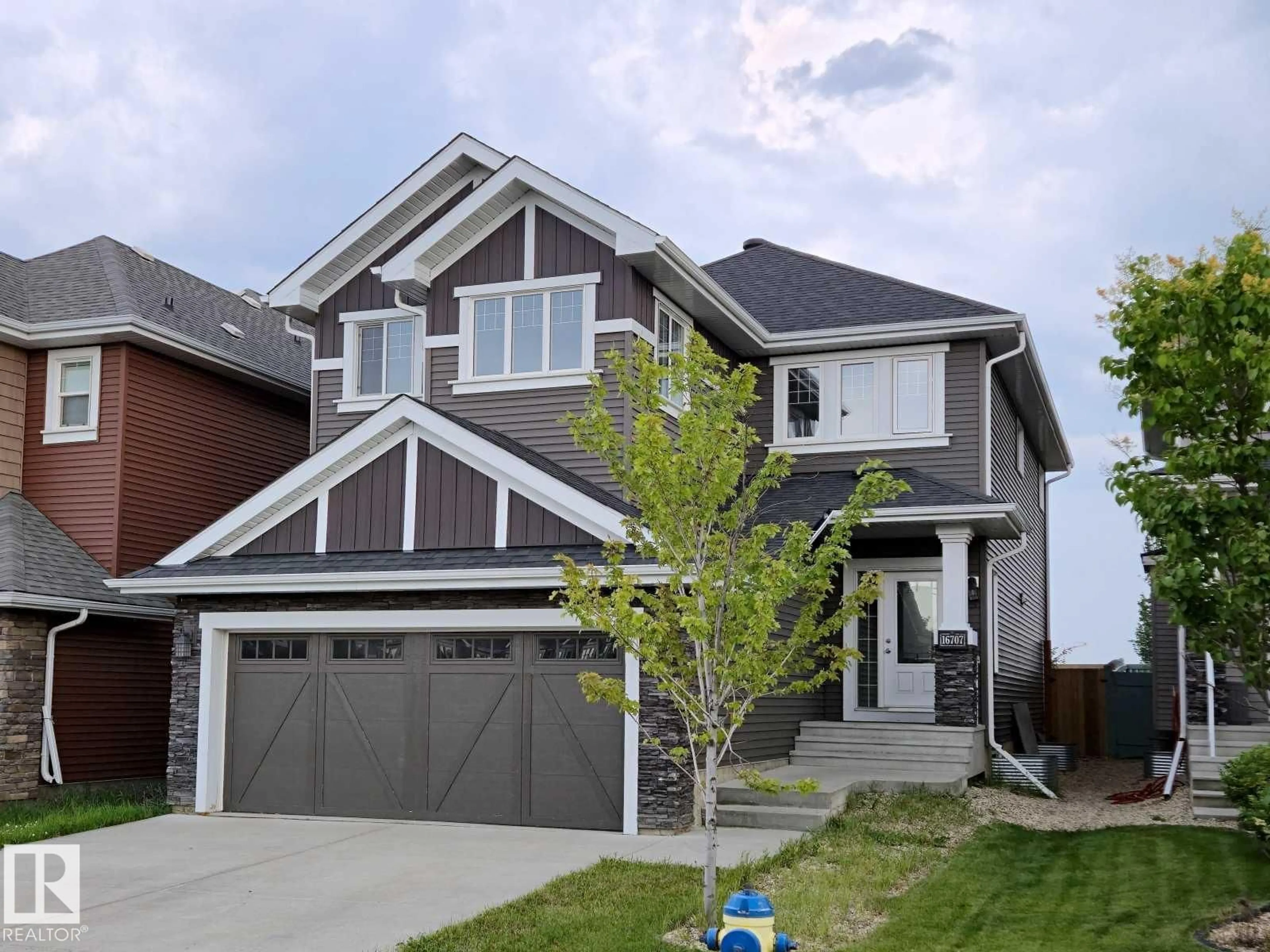 Home with brick exterior material, street for SW - 16707 18 AV, Edmonton Alberta T6W3C5