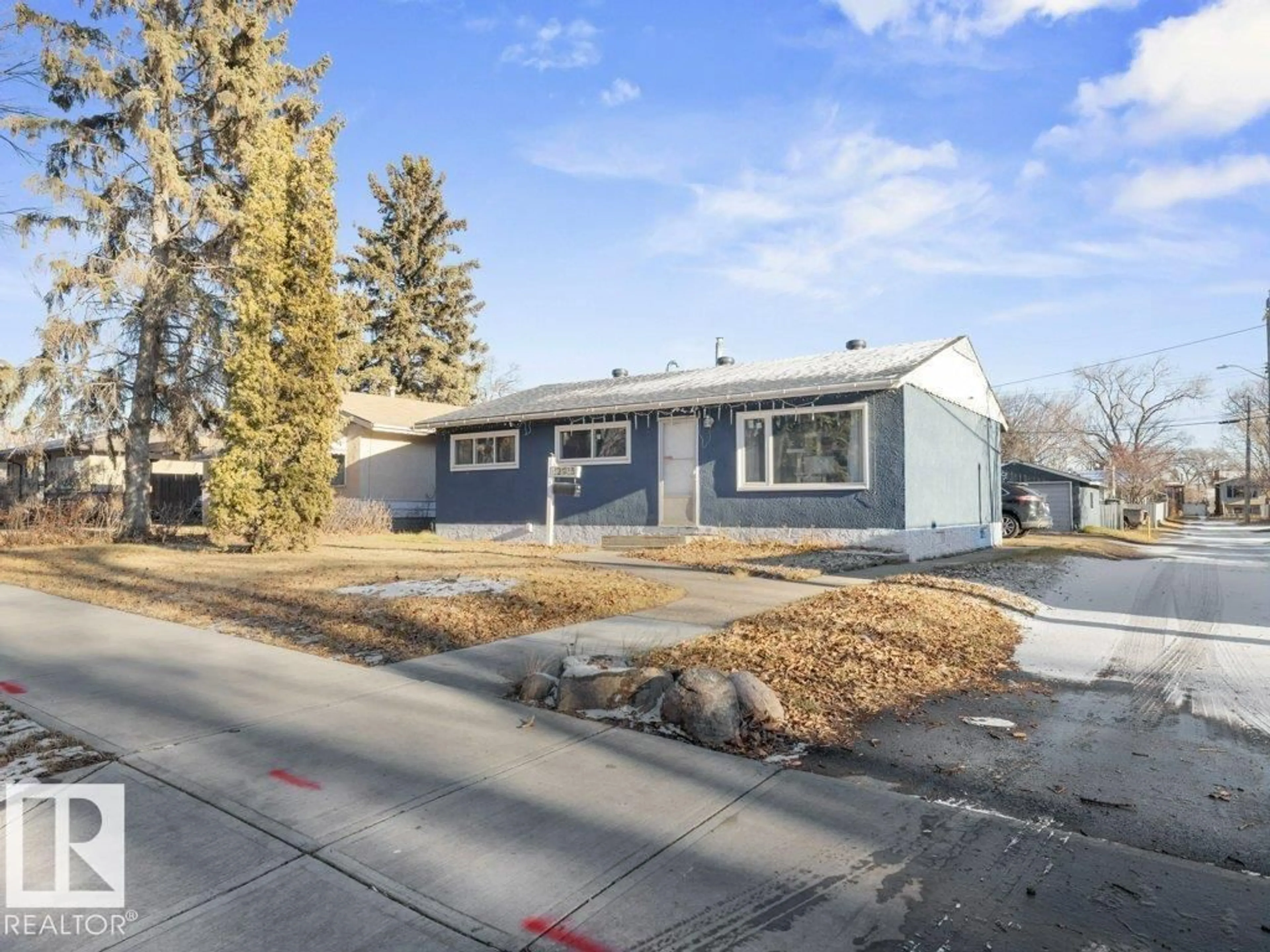 Home with vinyl exterior material, street for 12915 116 ST, Edmonton Alberta T5E5H3