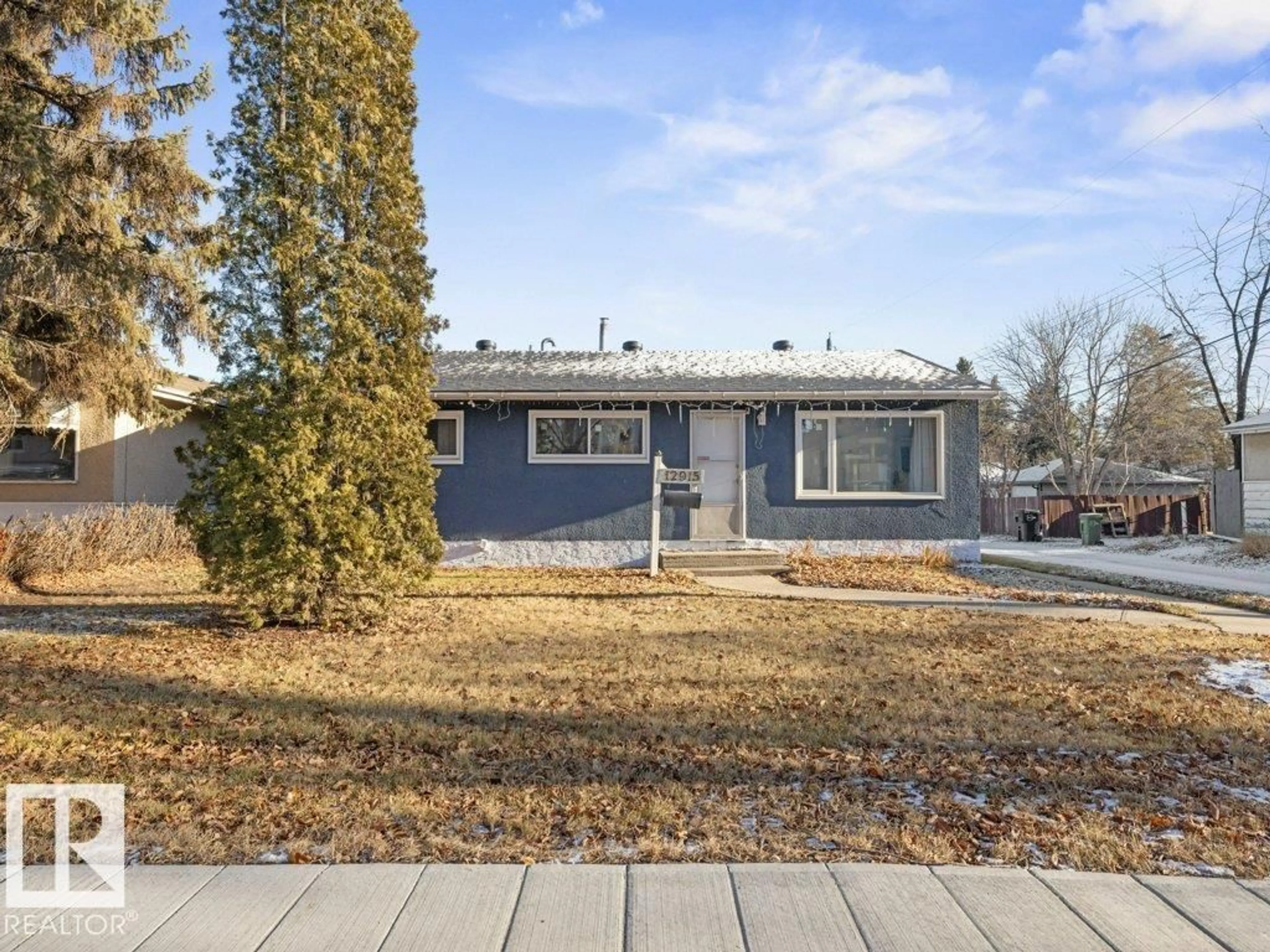 Home with vinyl exterior material, street for 12915 116 ST, Edmonton Alberta T5E5H3