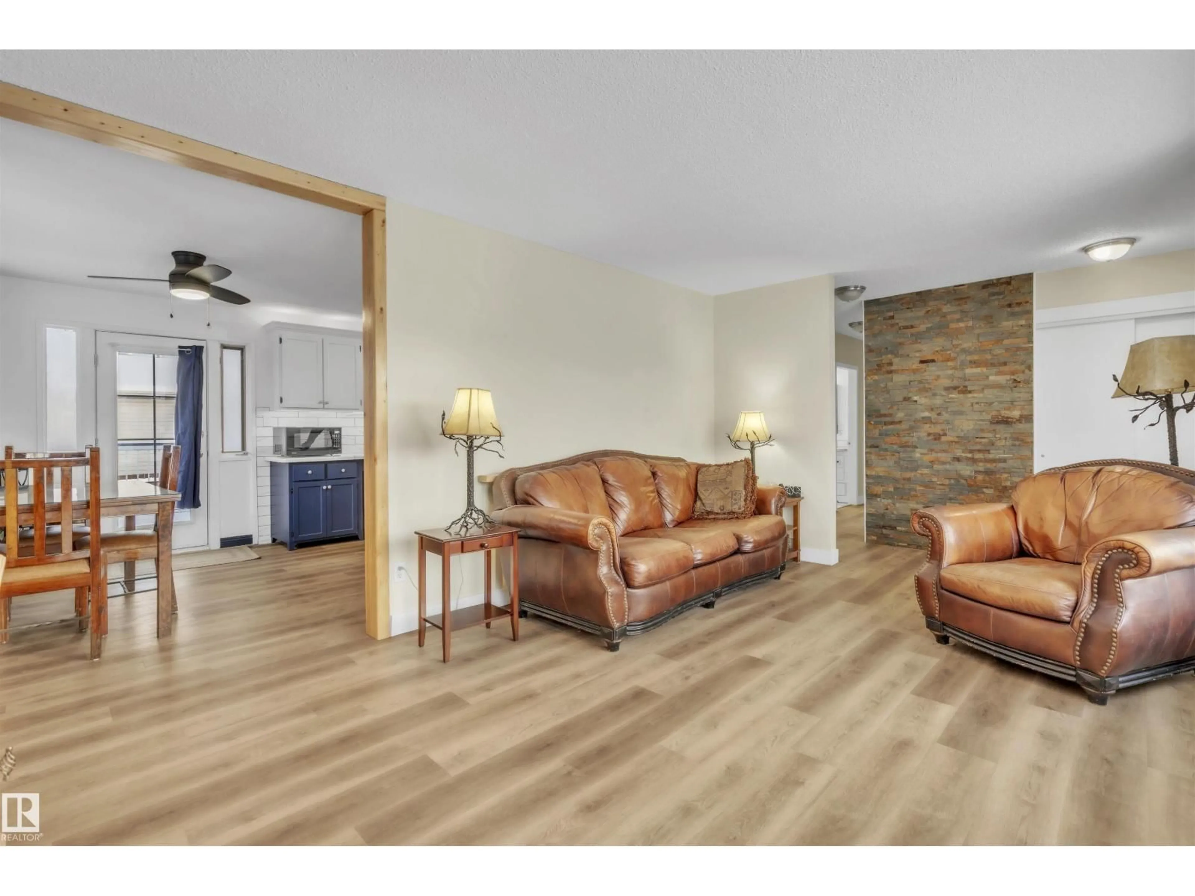 Living room with furniture, wood/laminate floor for 4611 46 ST, Bonnyville Town Alberta T9N1M1