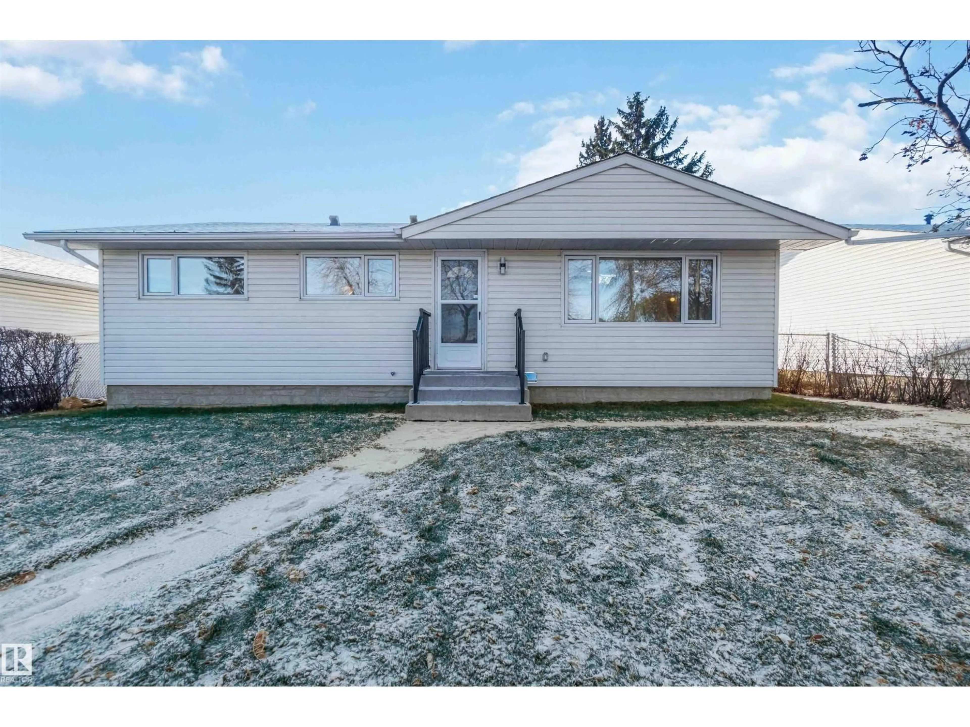 Home with vinyl exterior material, street for 5907 137 AV, Edmonton Alberta T5A0P1