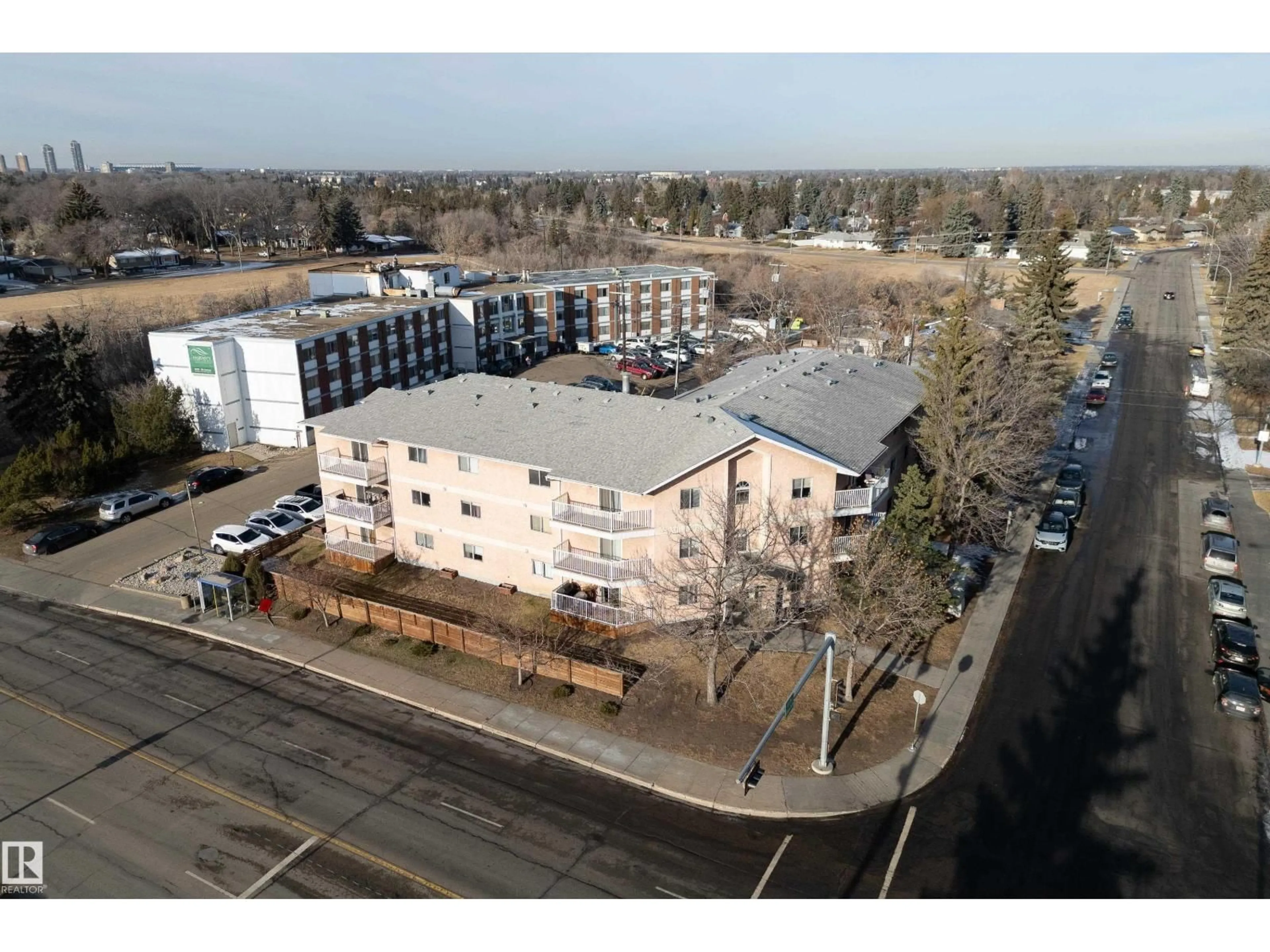 A pic from outside/outdoor area/front of a property/back of a property/a pic from drone, building for #105 - 6310 101 AV NW, Edmonton Alberta T6A0H5