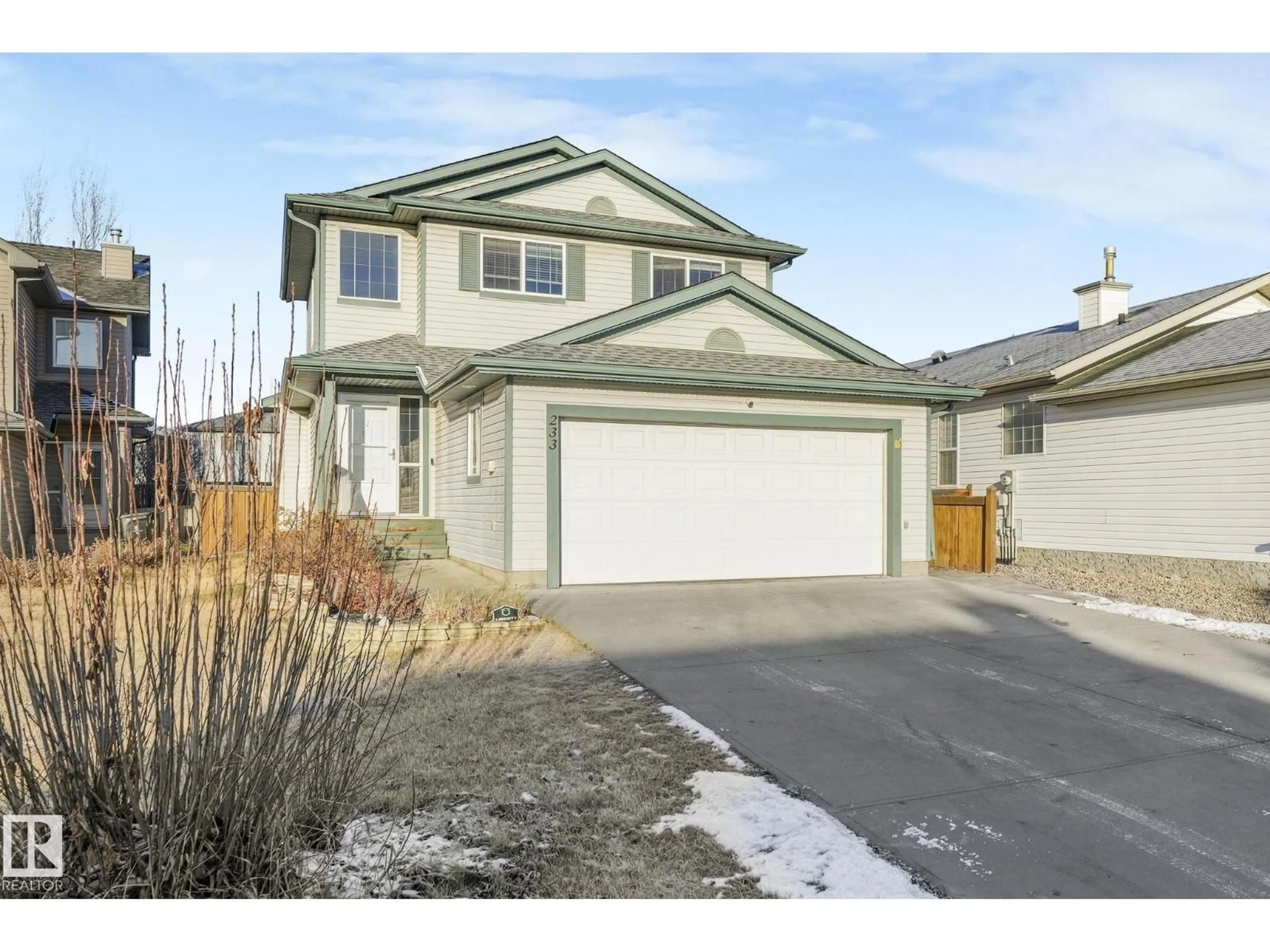 Home with vinyl exterior material, street for 233 WESTWOOD LN, Fort Saskatchewan Alberta T8L4N6