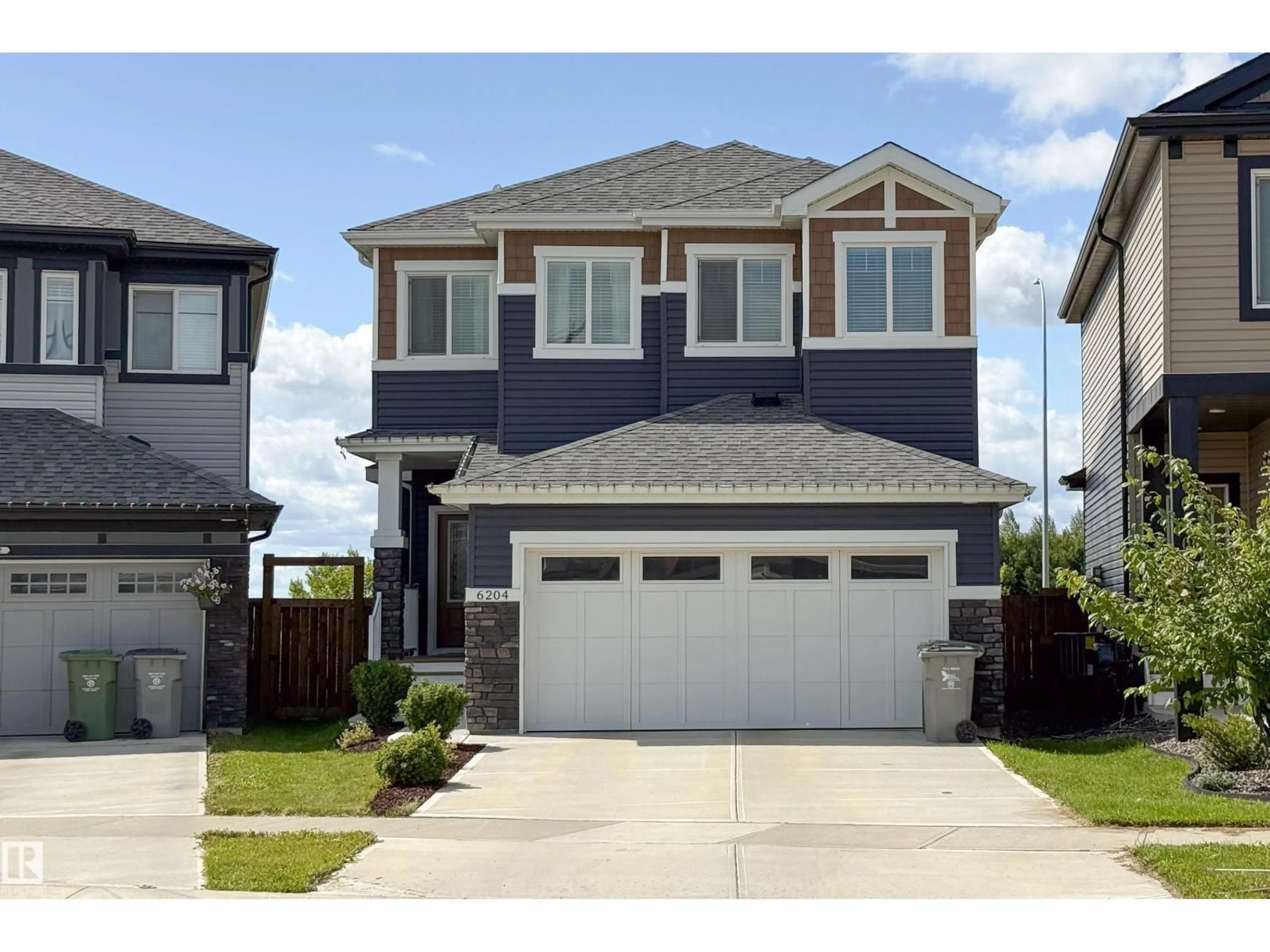 Home with vinyl exterior material, street for 6204 67 ST, Beaumont Alberta T4X2E3