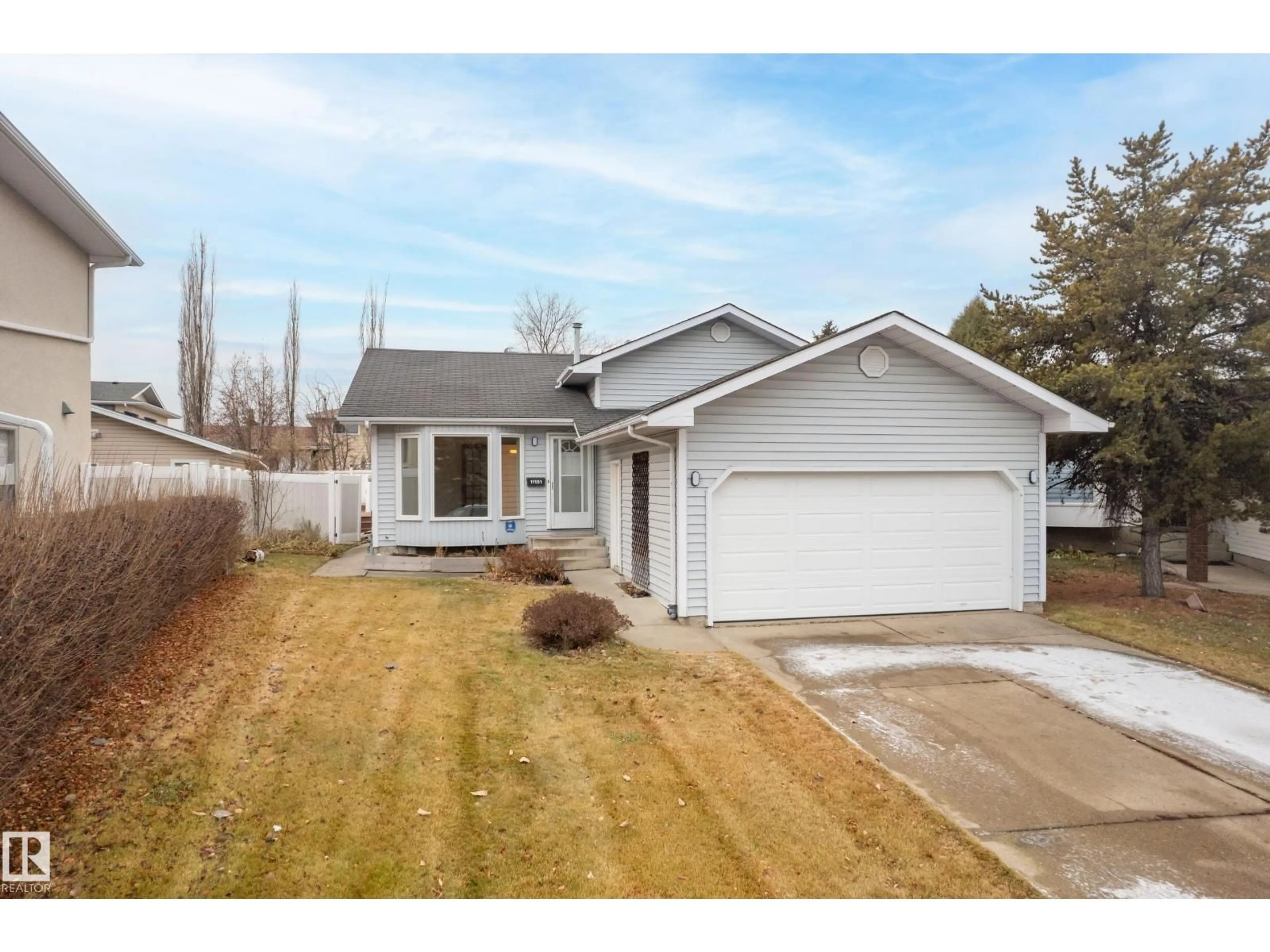 Home with vinyl exterior material, street for 11151 26 AV, Edmonton Alberta T6J5M7