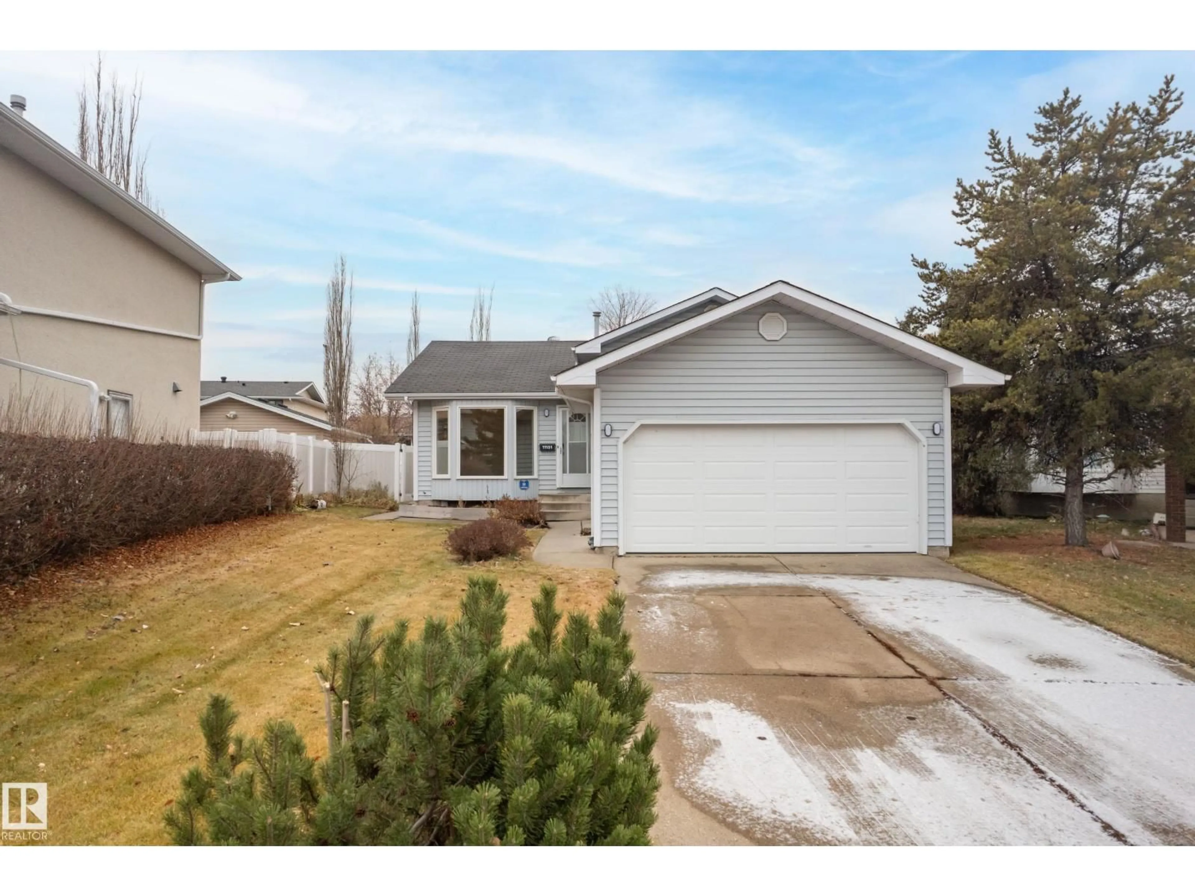 Home with vinyl exterior material, street for 11151 26 AV, Edmonton Alberta T6J5M7