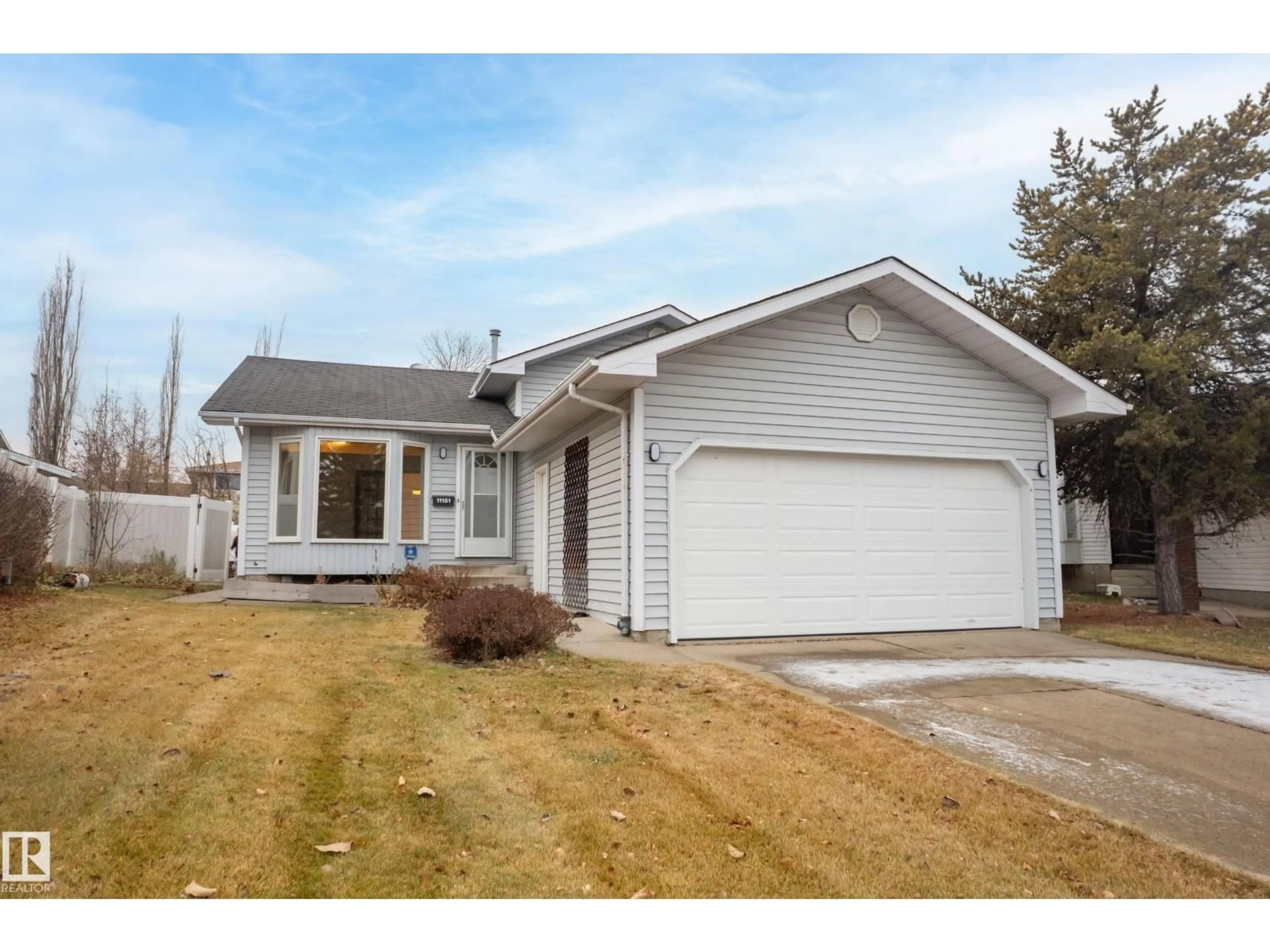 Home with vinyl exterior material, street for 11151 26 AV, Edmonton Alberta T6J5M7