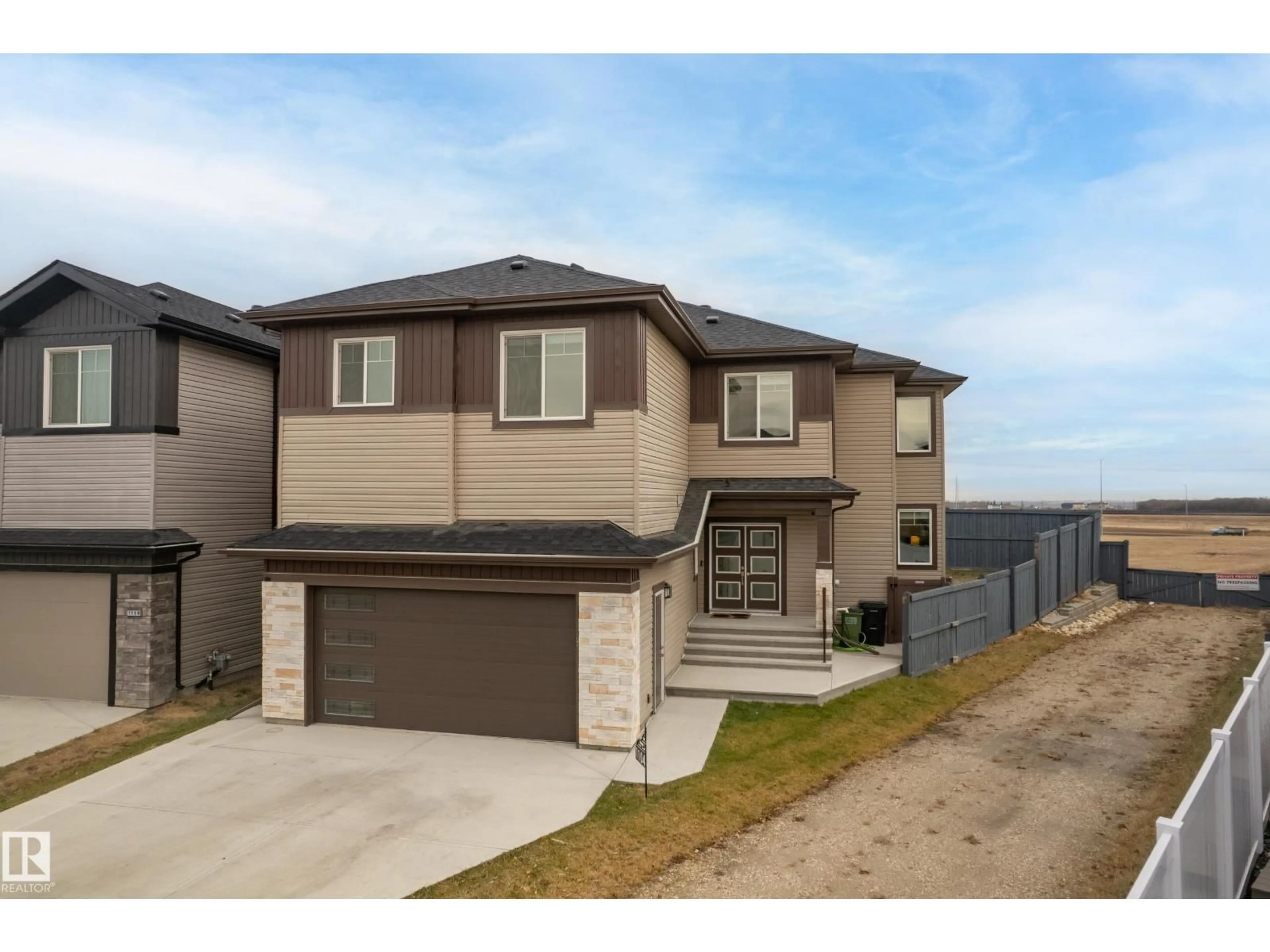Home with brick exterior material, street for NW - 1104 152 AV, Edmonton Alberta T5Y4C8