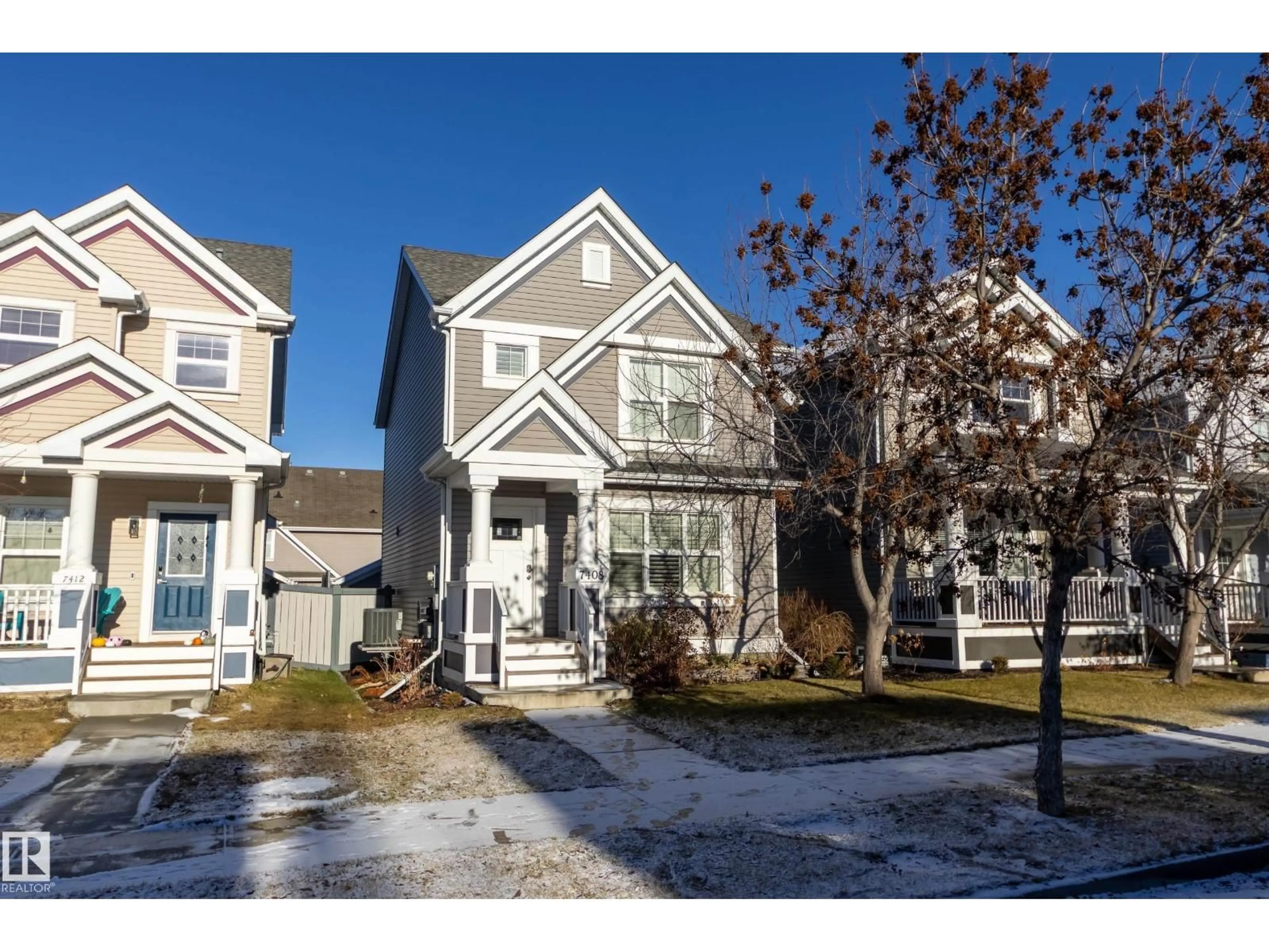 Home with vinyl exterior material, street for SW - 7408 15A AV, Edmonton Alberta T6X0E1