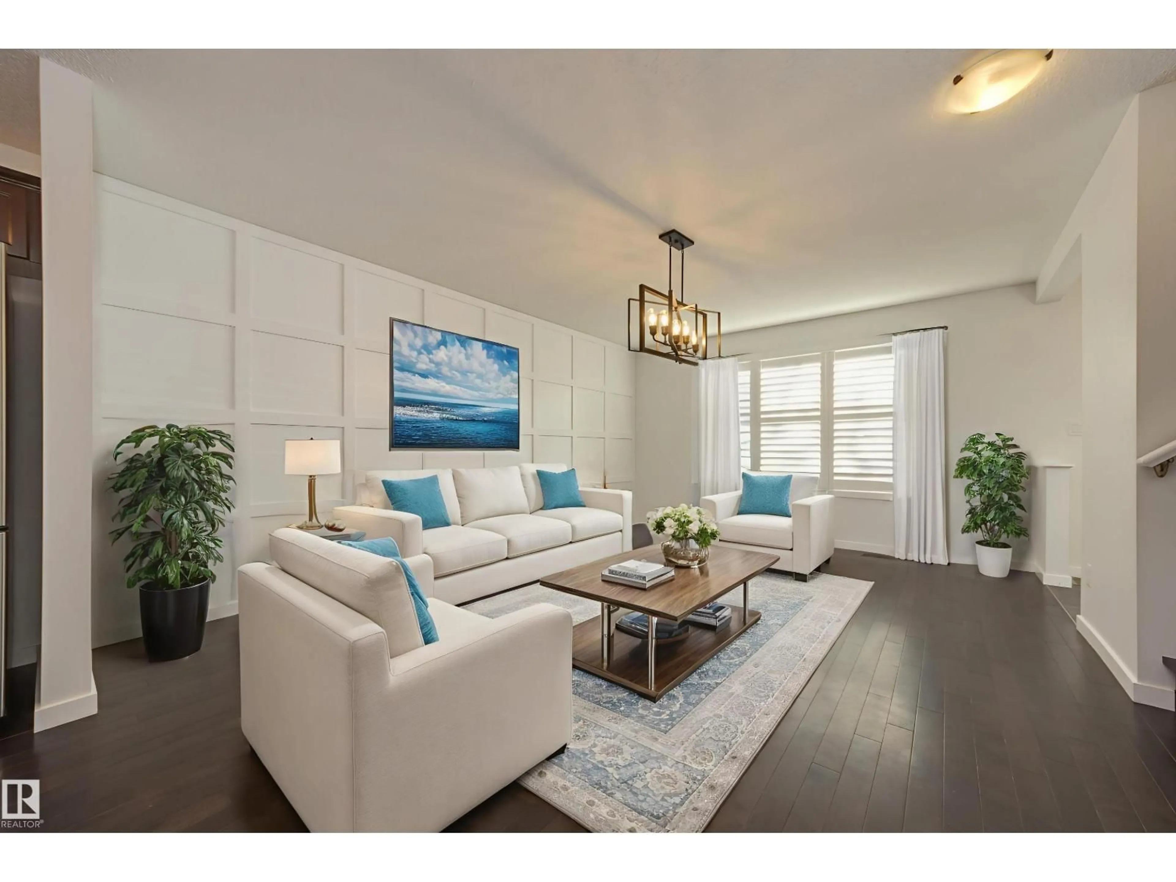 Living room with furniture, wood/laminate floor for SW - 7408 15A AV, Edmonton Alberta T6X0E1