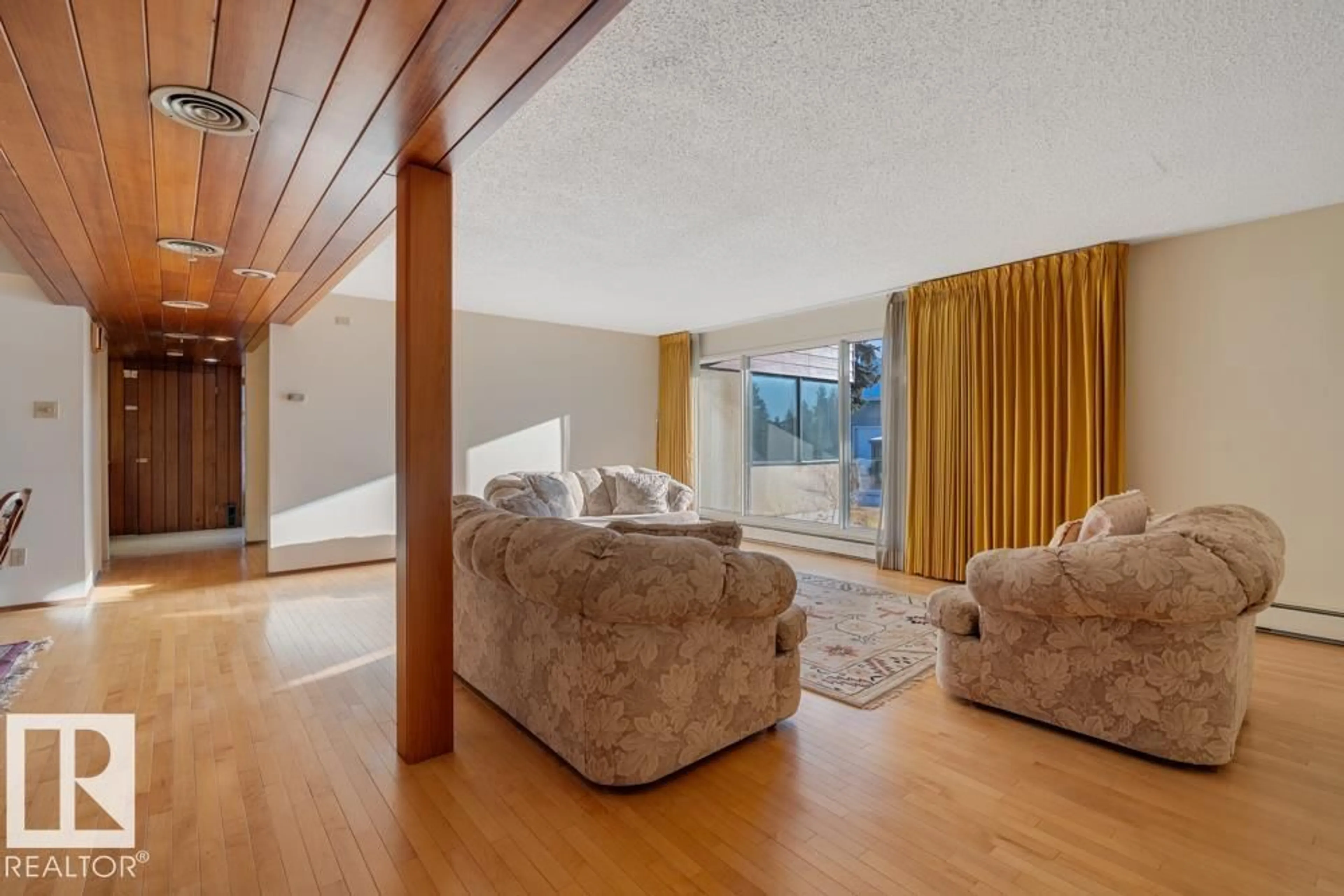 Living room with furniture, wood/laminate floor for 11109 70 ST, Edmonton Alberta T5B1S8