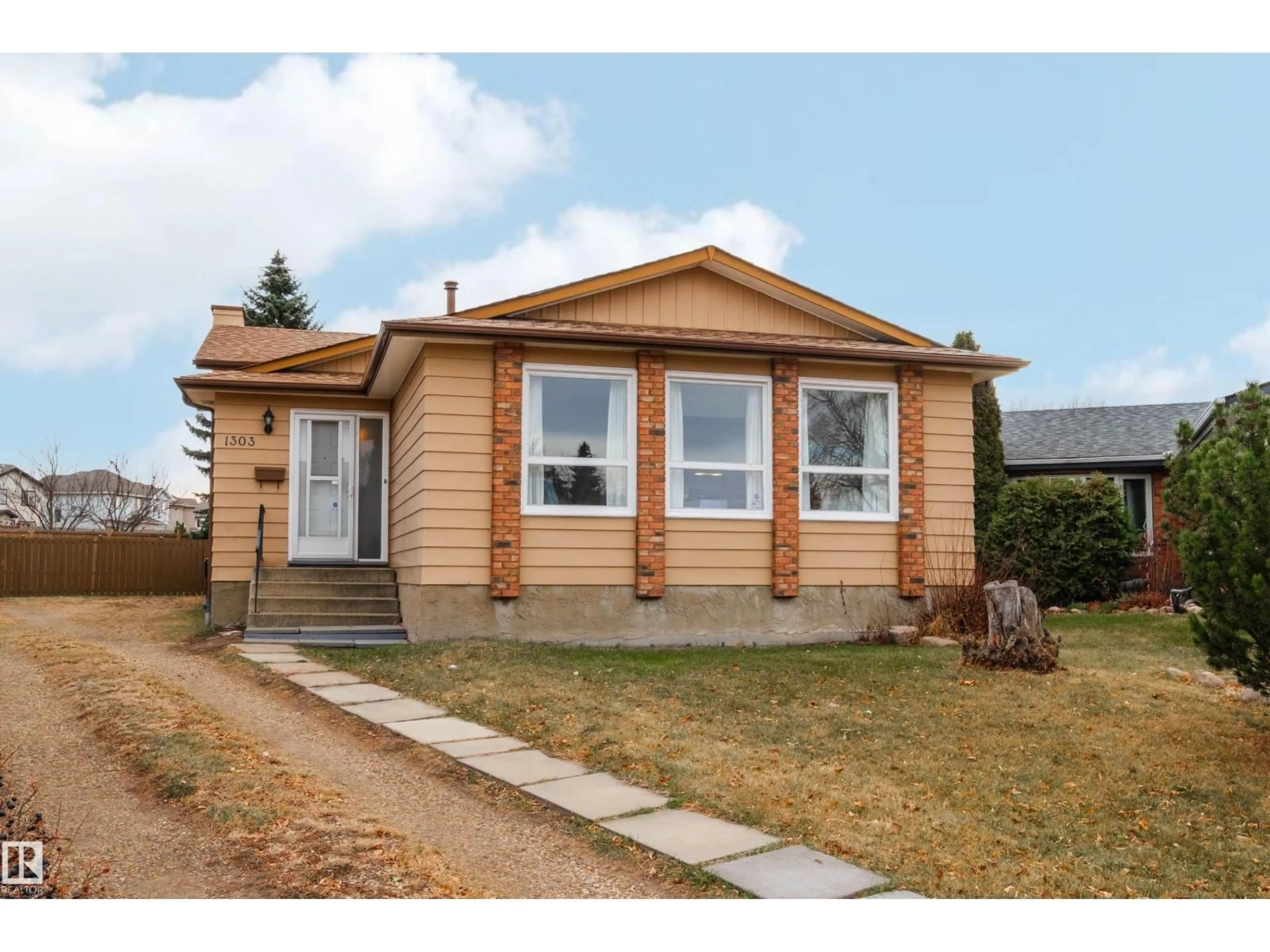 Home with vinyl exterior material, street for 1303 35 ST, Edmonton Alberta T6L2M2