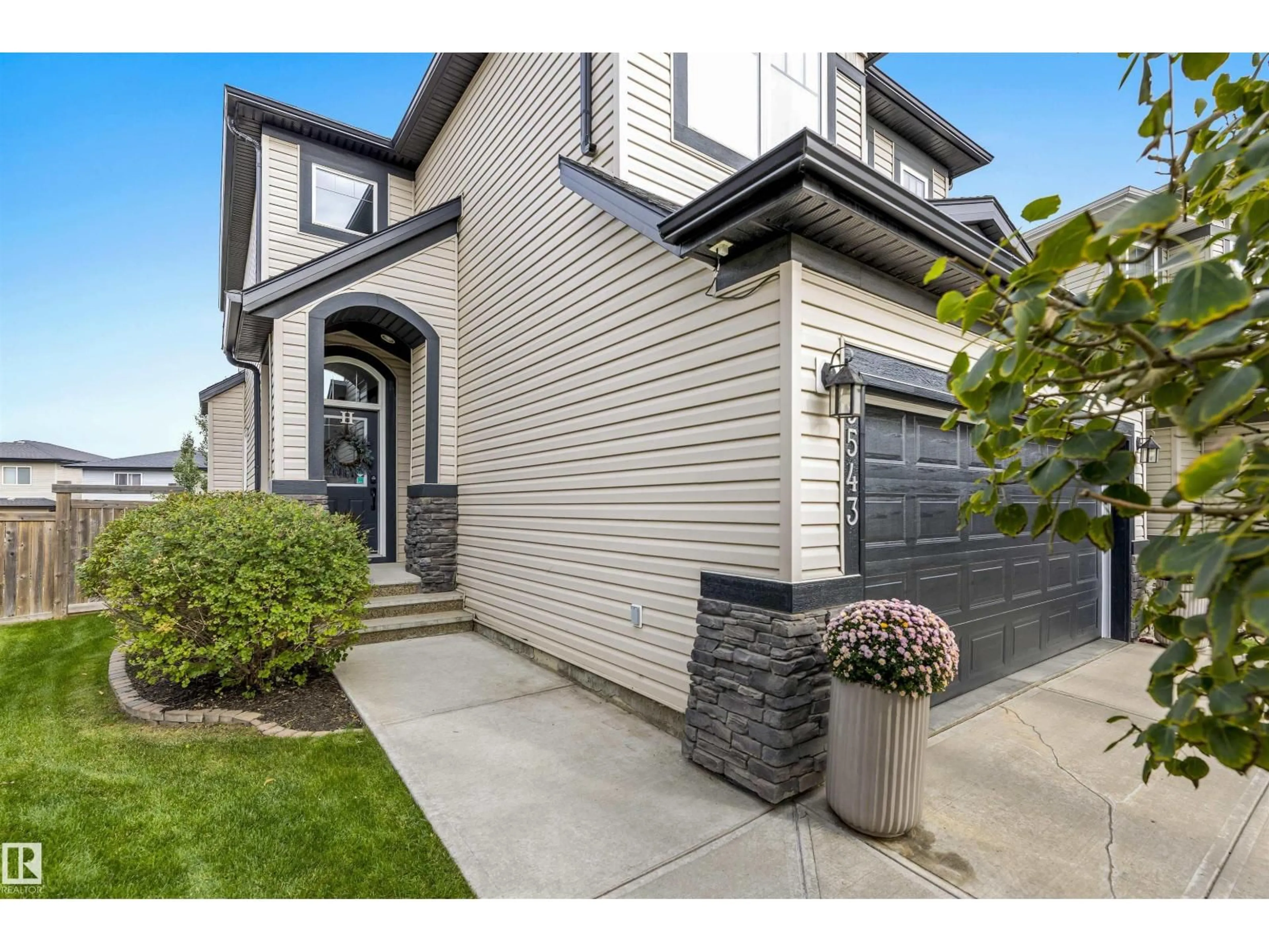 Home with vinyl exterior material, street for 9543 221 ST, Edmonton Alberta T5T4A8