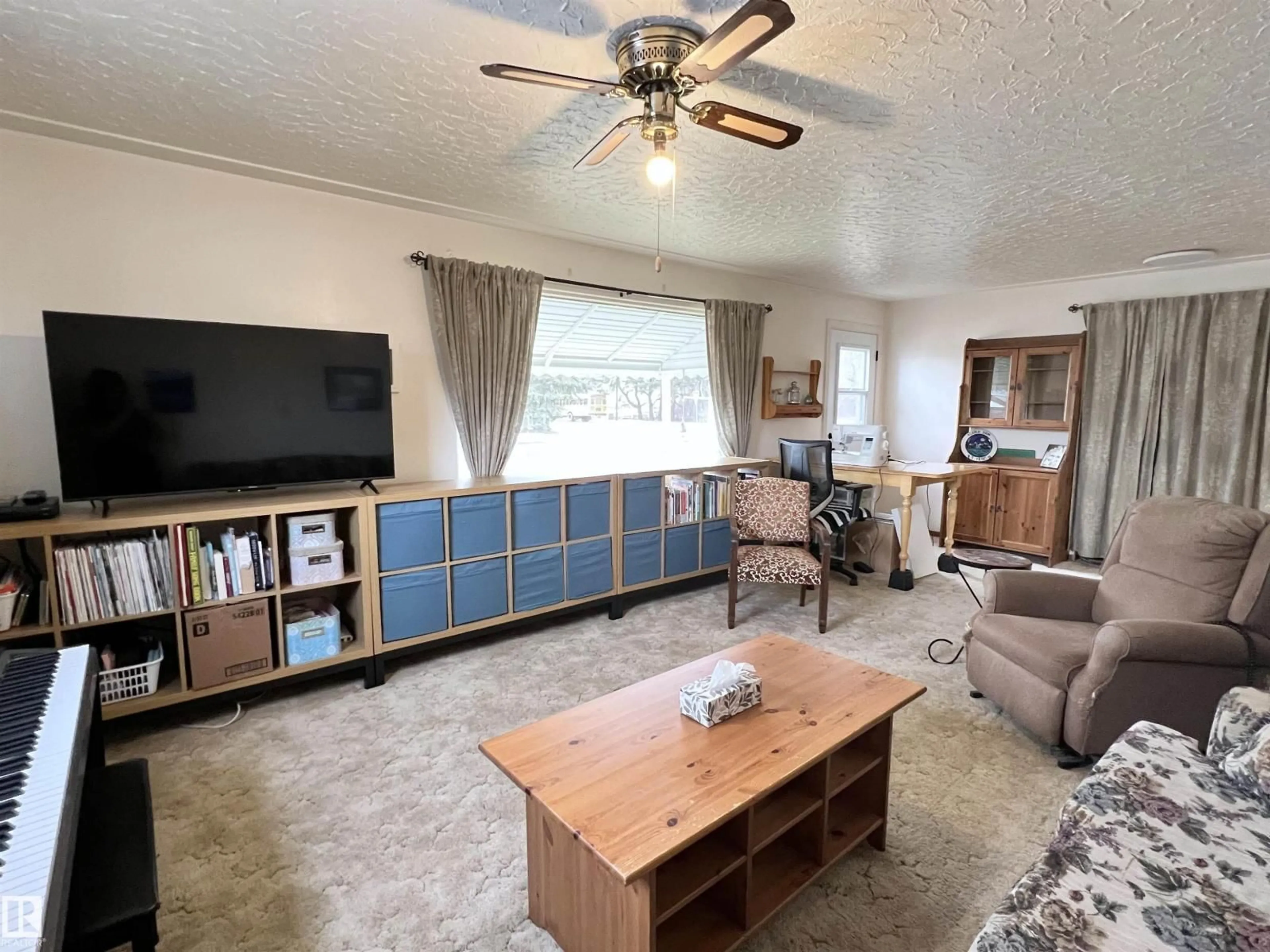 Living room with furniture, wood/laminate floor for 4944 48 AV, Bon Accord Alberta T0A0K0