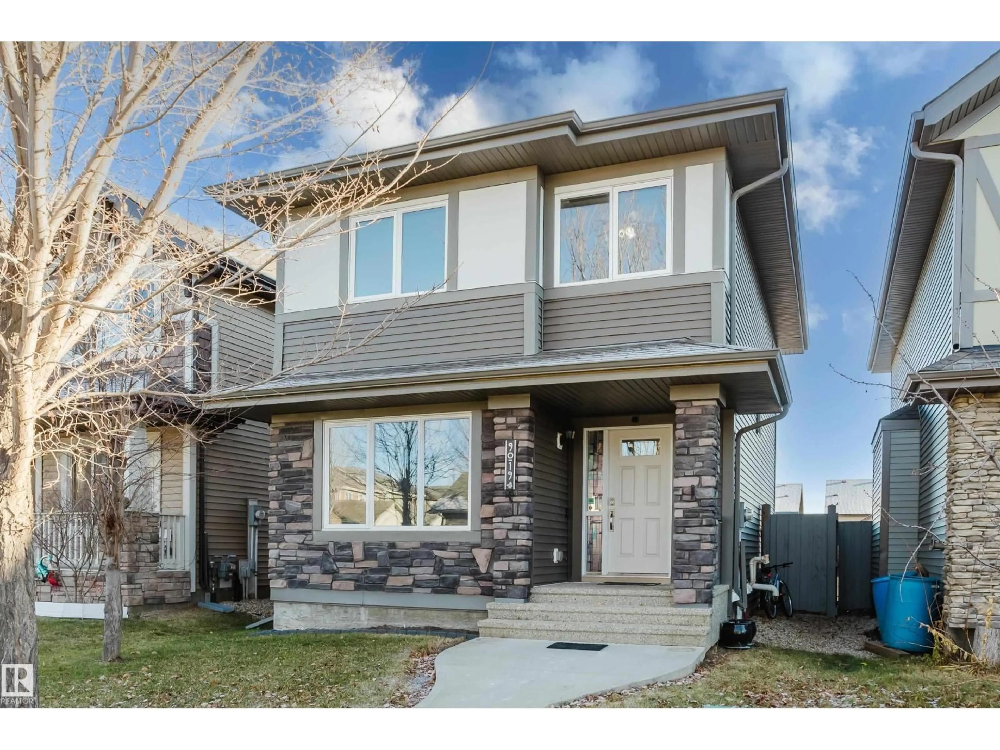 Home with vinyl exterior material, street for NW - 9019 219 ST, Edmonton Alberta T5T6Z9