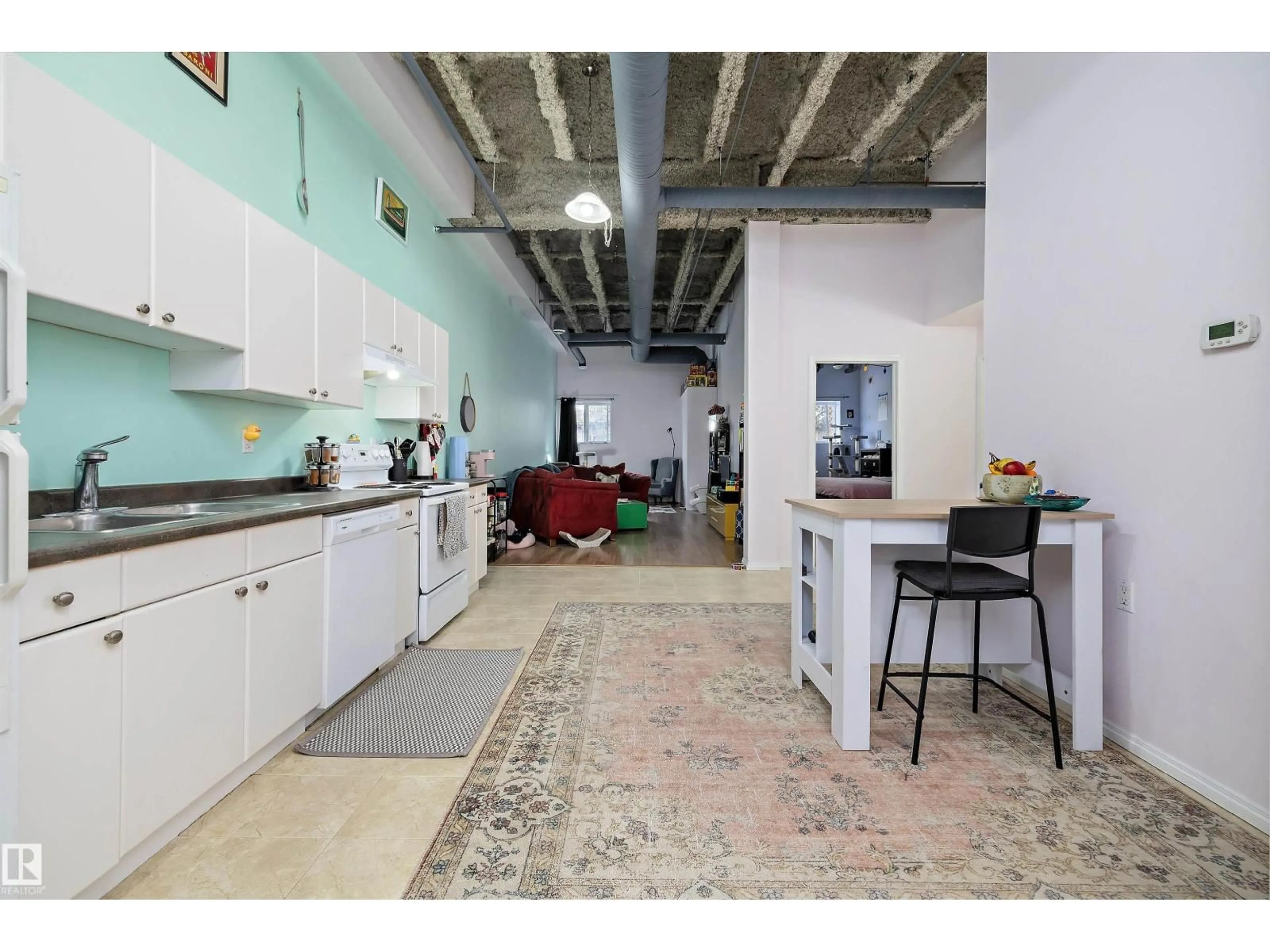 Kitchen with laundary machines, unknown for #103 - 9817 103 ST, Fort Saskatchewan Alberta T8L2C7