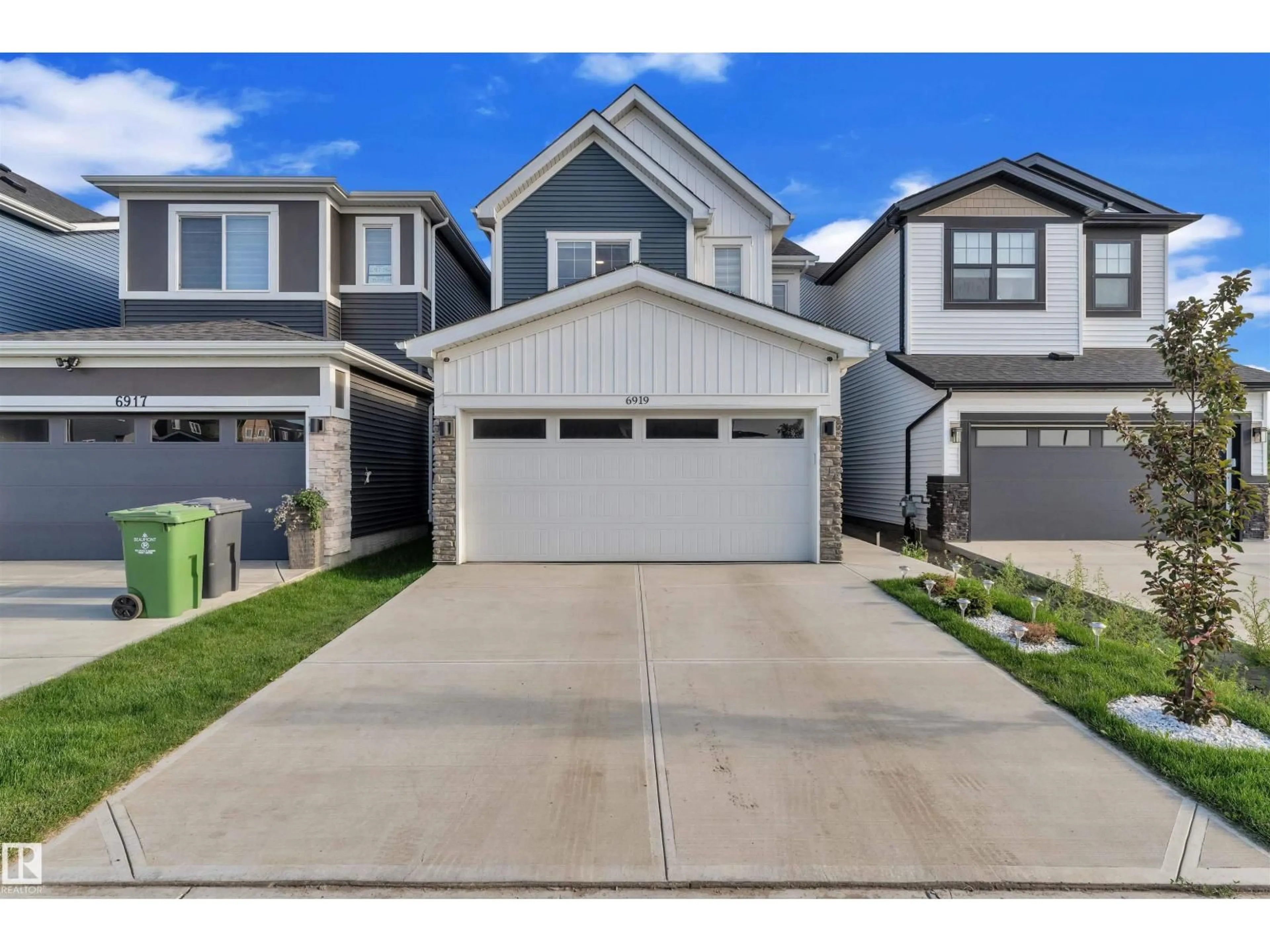 Home with vinyl exterior material, street for 6919 54 AV, Beaumont Alberta T4X2Z7