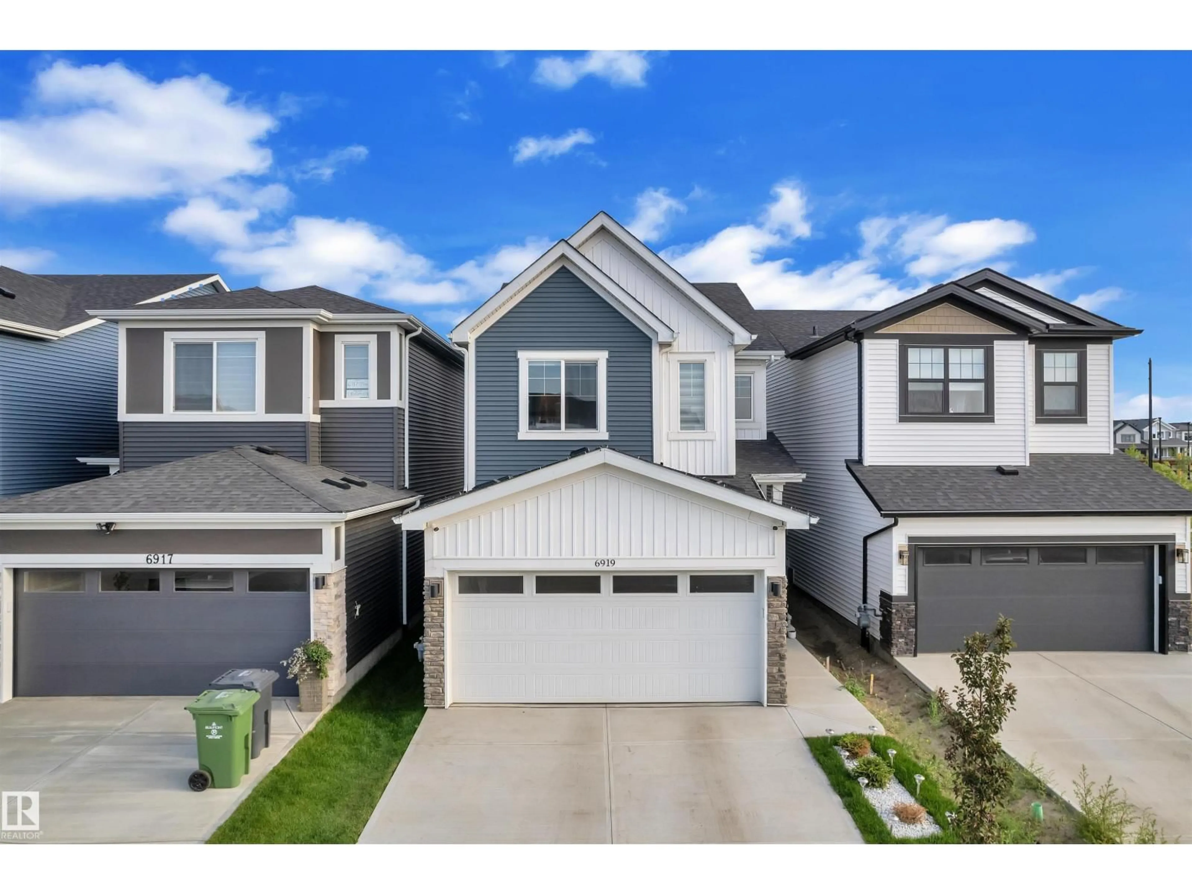 Home with vinyl exterior material, street for 6919 54 AV, Beaumont Alberta T4X2Z7