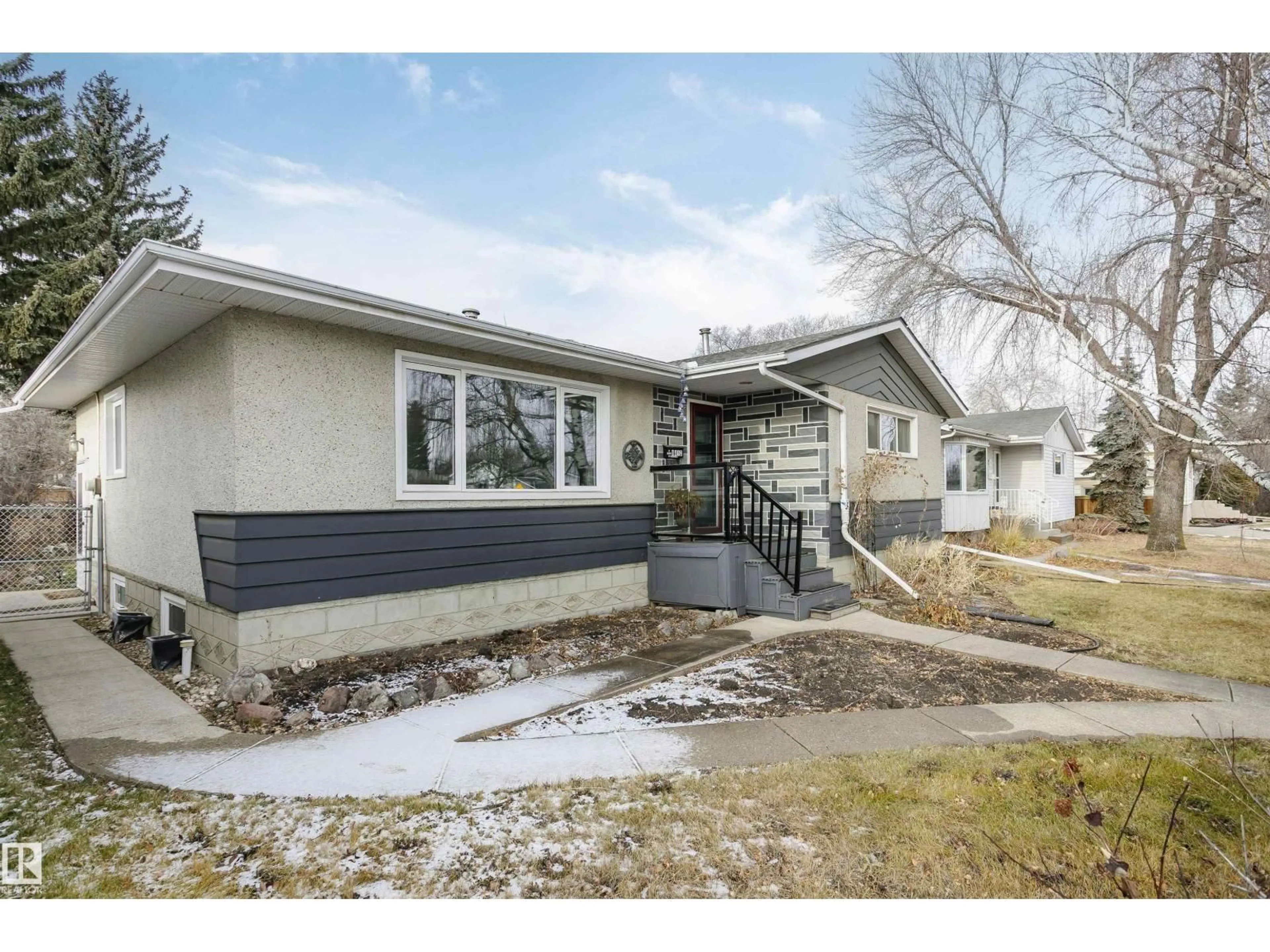 Home with vinyl exterior material, street for 8412 71 ST, Edmonton Alberta T6B1X4