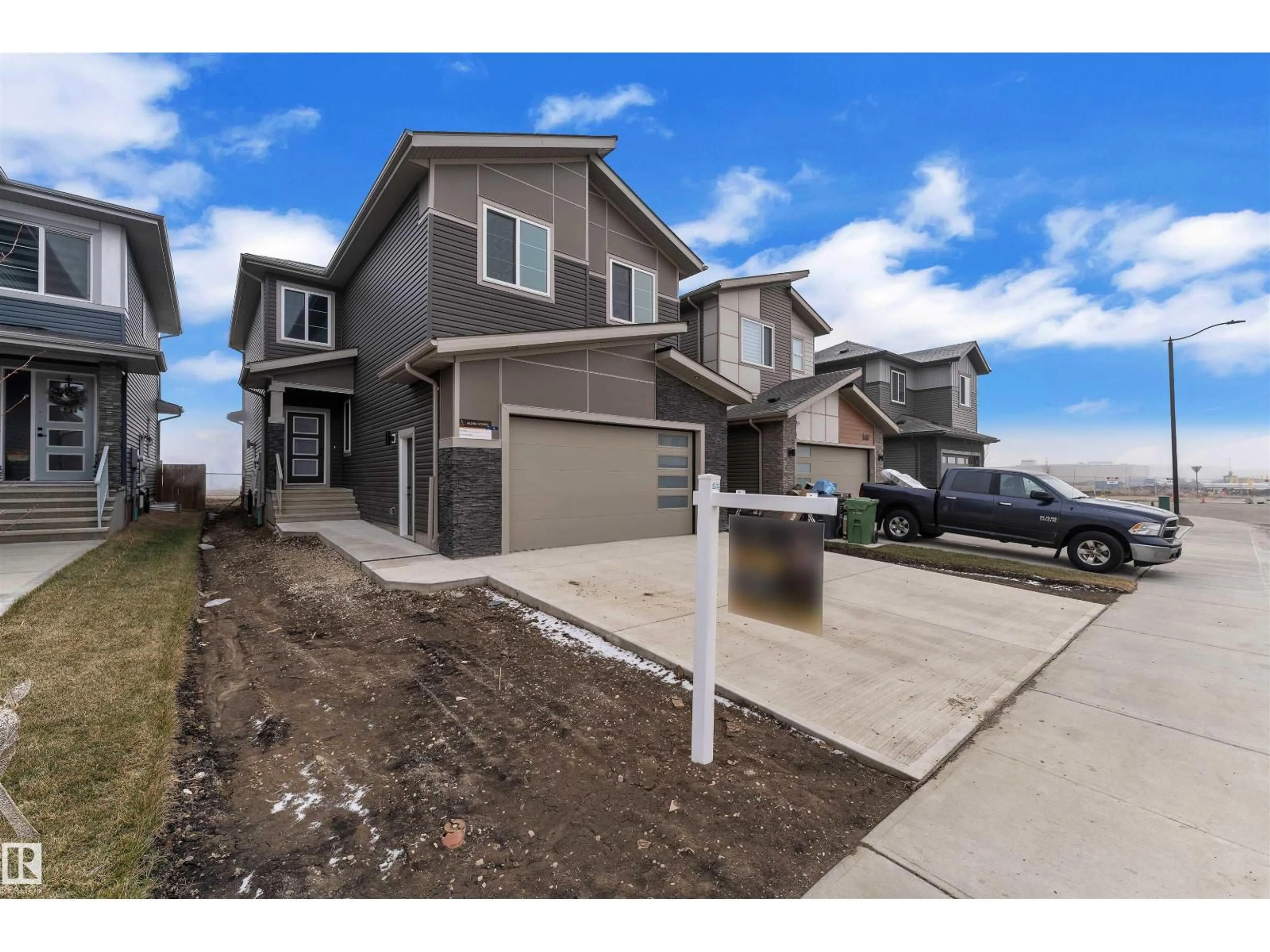 Home with vinyl exterior material, street for 404 PINE PT, Leduc Alberta T9E1S7