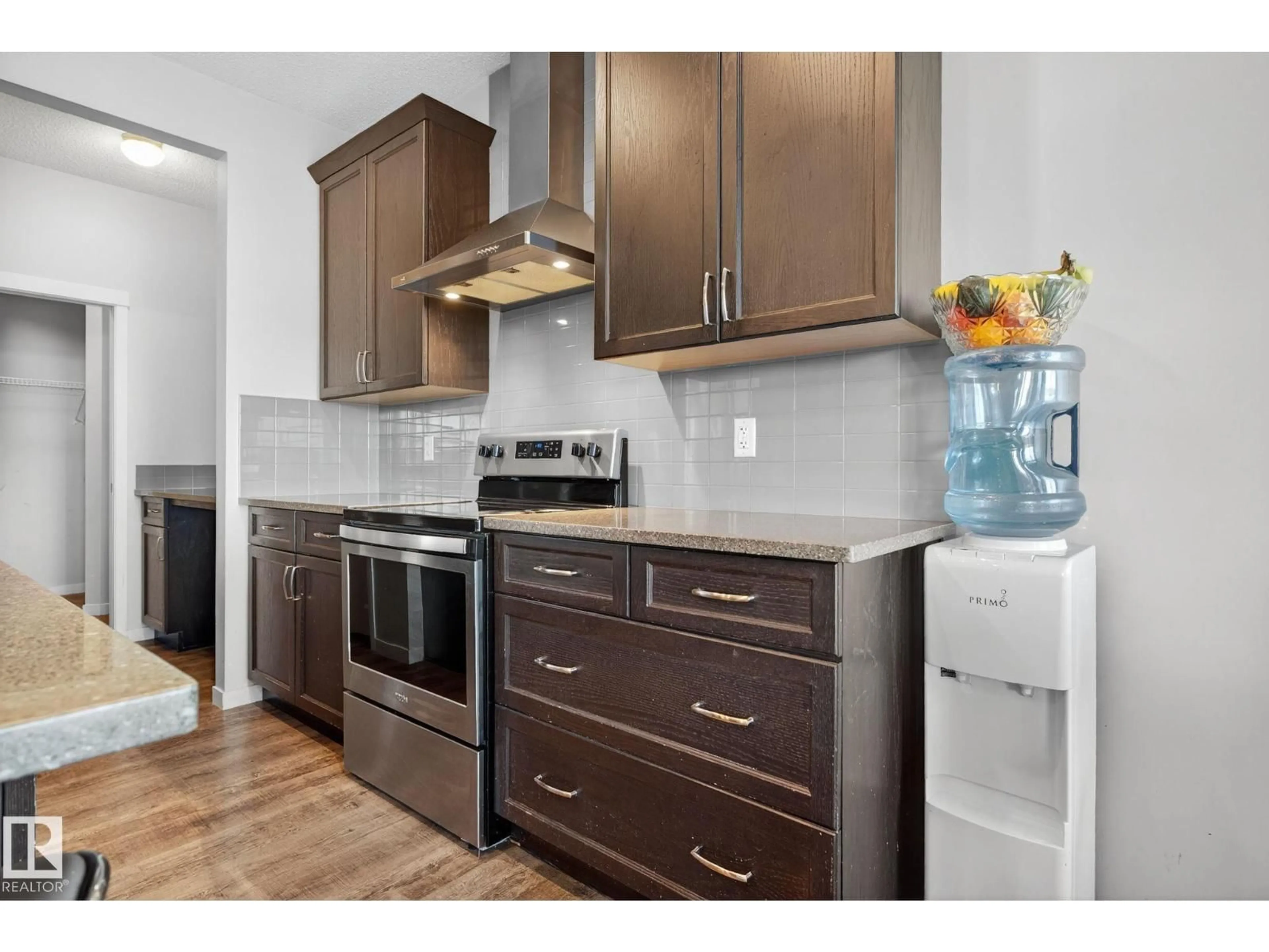 Open concept kitchen, wood/laminate floor for SW - 2031 51 ST, Edmonton Alberta T6X1Z8