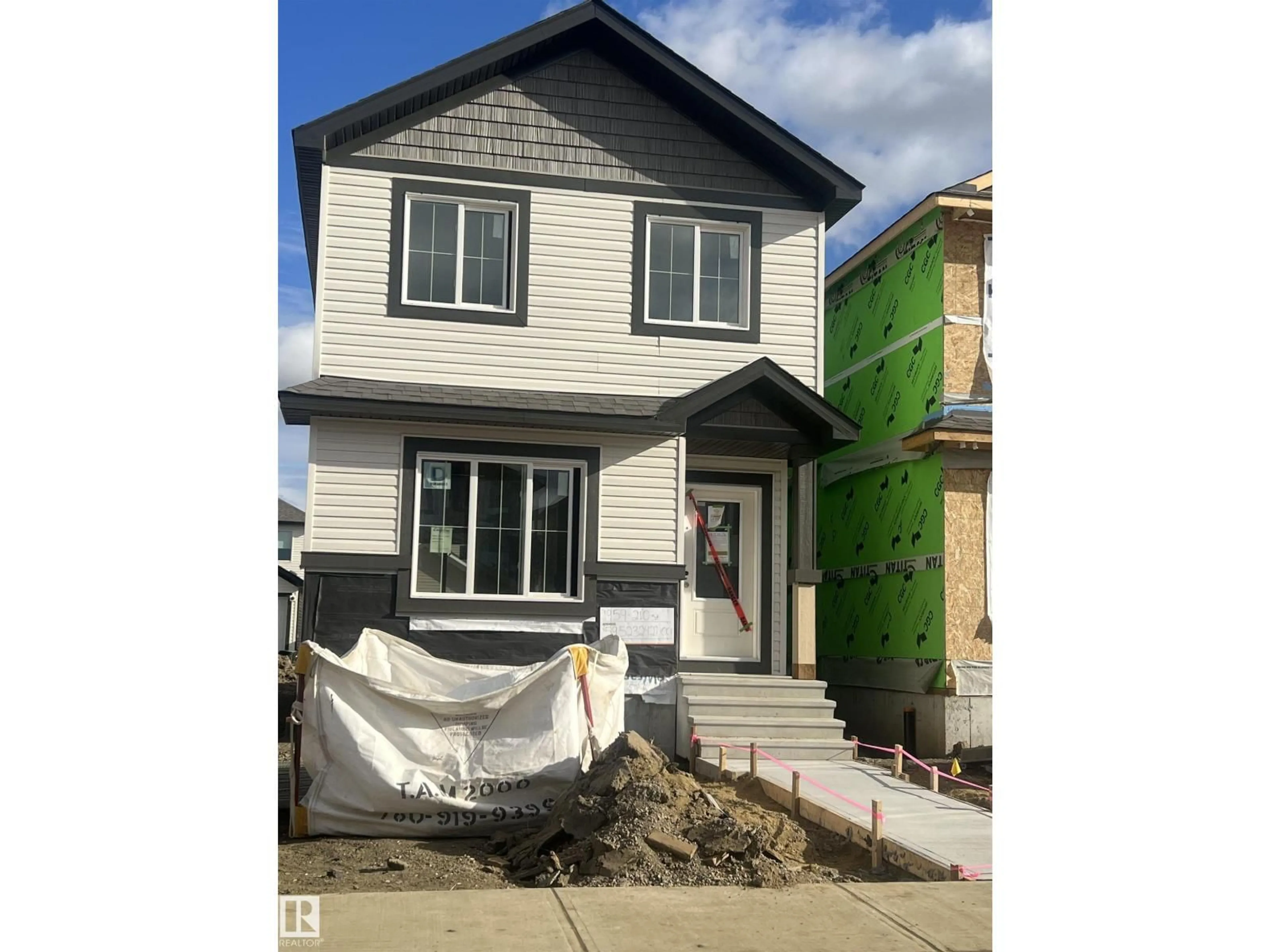 Home with vinyl exterior material, street for NW - 1959 210 ST, Edmonton Alberta T6M1L2