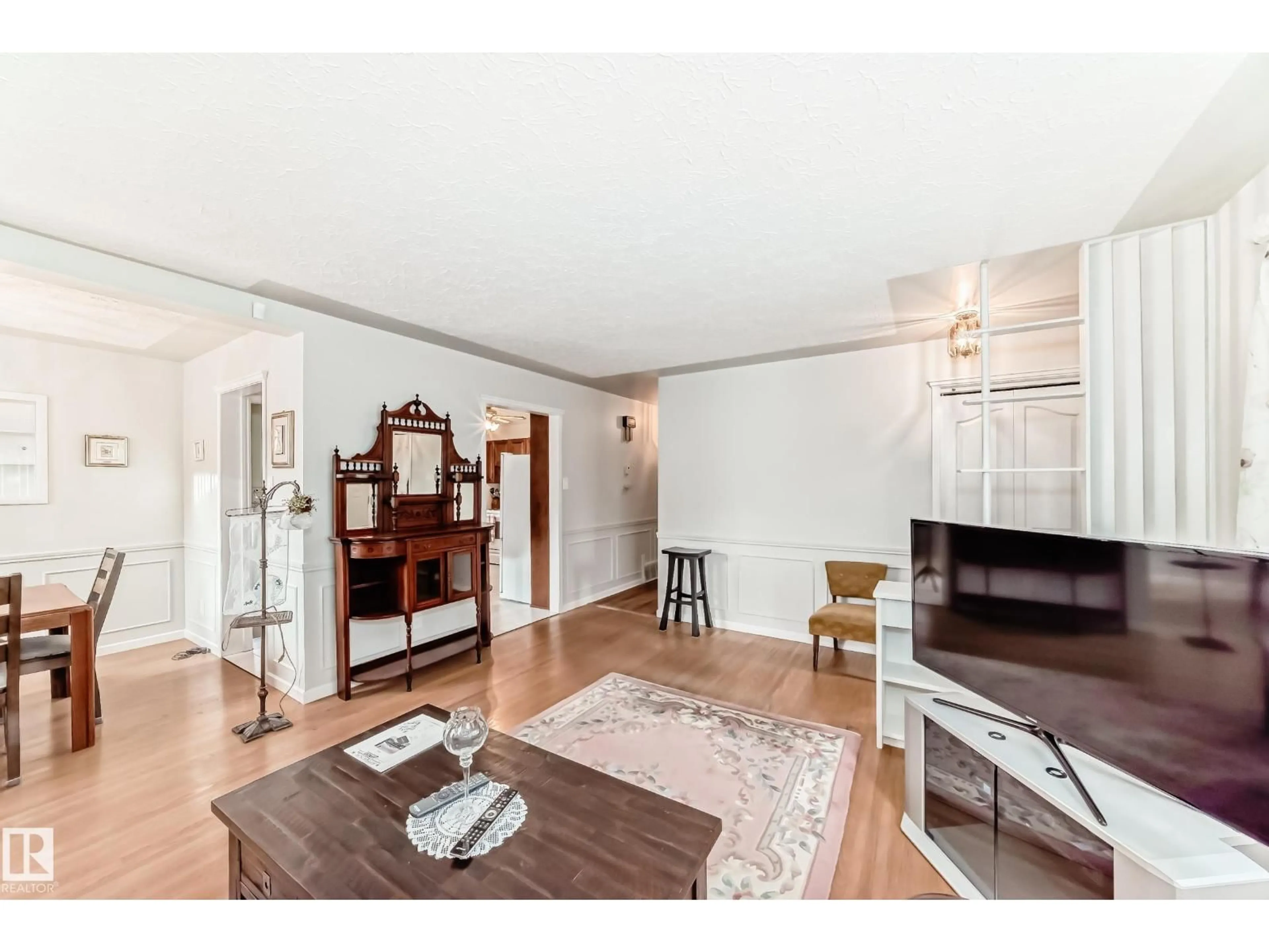 Living room with furniture, wood/laminate floor for NW - 8602 158 ST, Edmonton Alberta T5R2C4