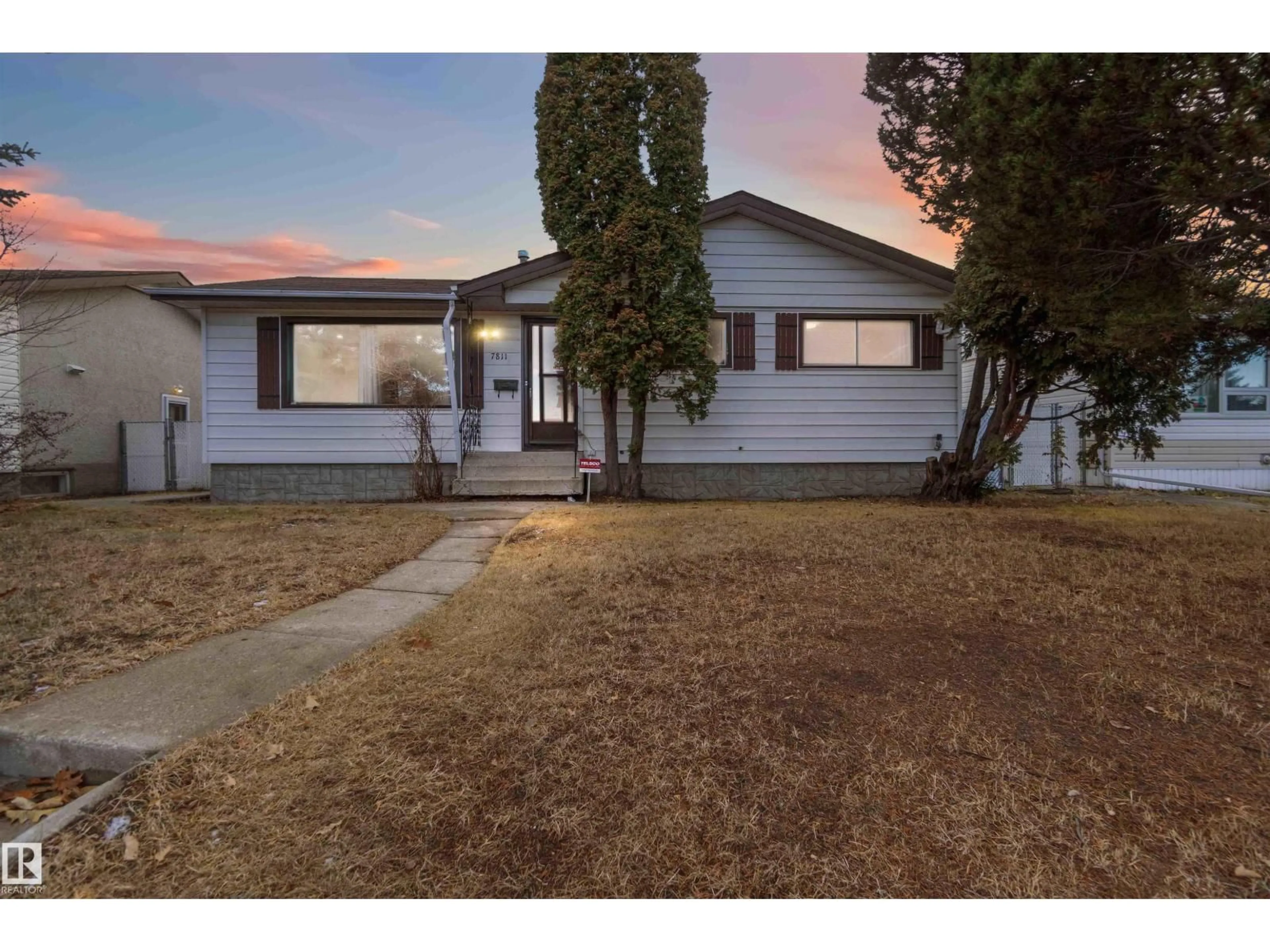 Home with vinyl exterior material, street for 7811 130A AV, Edmonton Alberta T5C1Z3