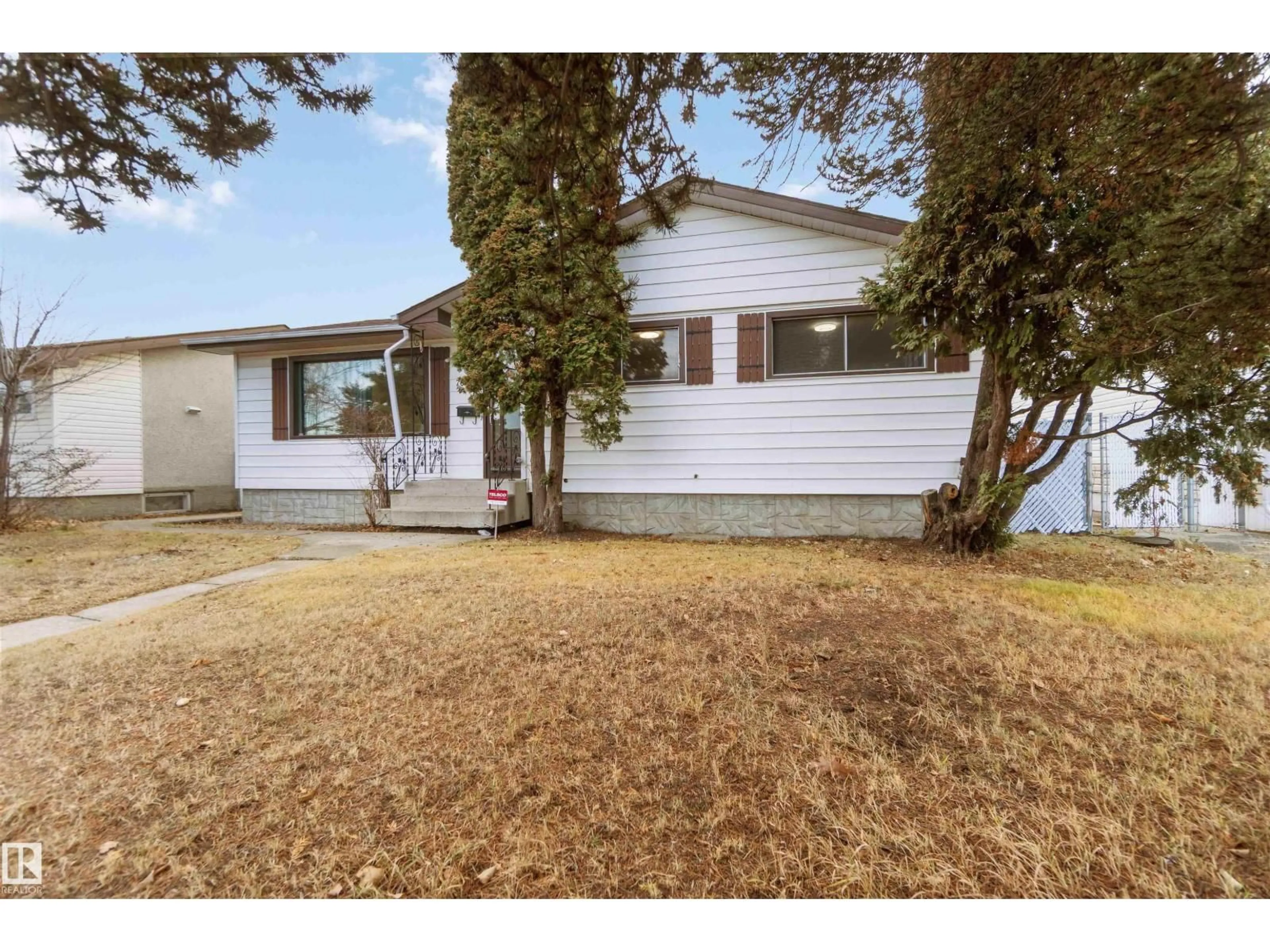 Home with vinyl exterior material, street for 7811 130A AV, Edmonton Alberta T5C1Z3