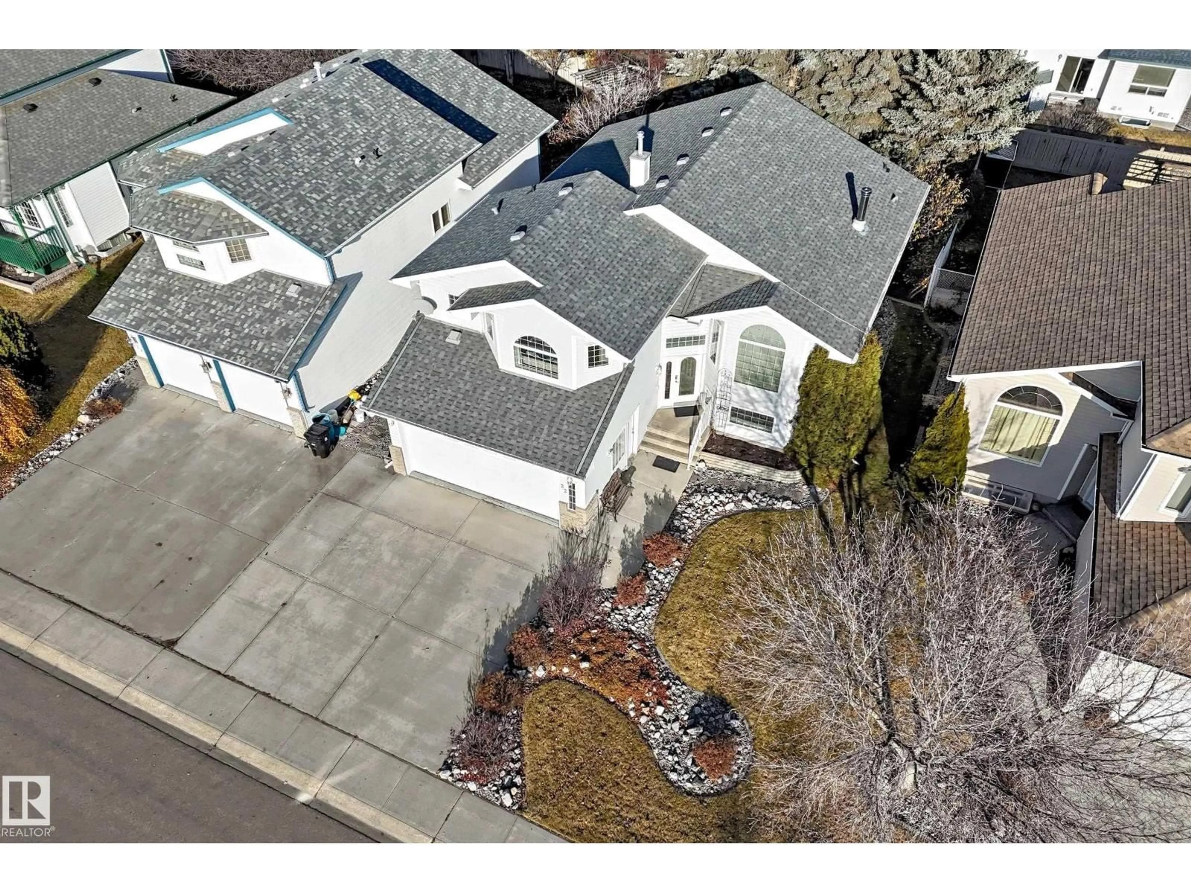 A pic from outside/outdoor area/front of a property/back of a property/a pic from drone, street for 22 LAKEWOOD CV, Spruce Grove Alberta T7X4B4