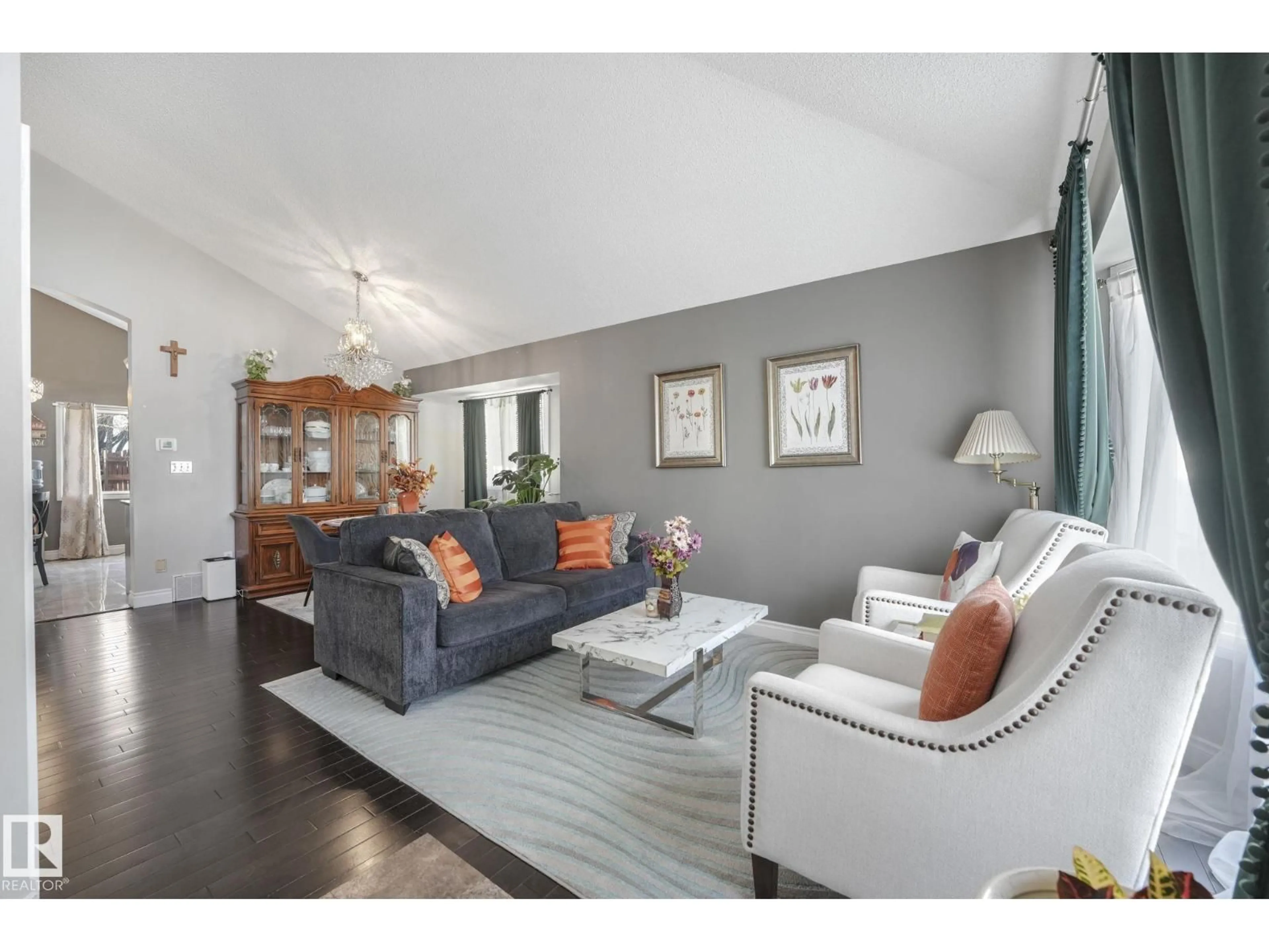 Living room with furniture, wood/laminate floor for NW - 9540 177 AV, Edmonton Alberta T5Z2C9