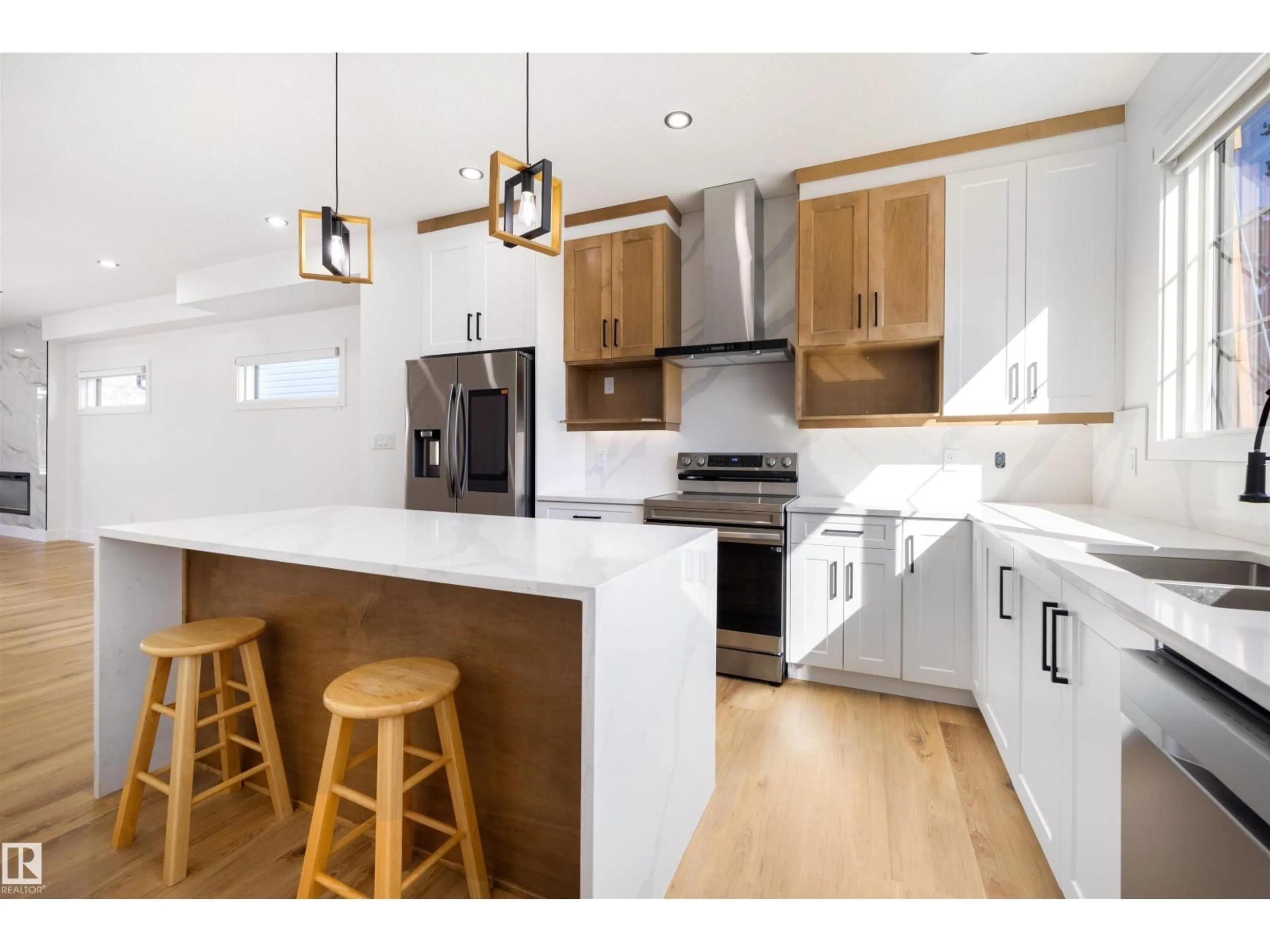 Open concept kitchen, wood/laminate floor for NW - 10711 52 ST, Edmonton Alberta T6A2H1