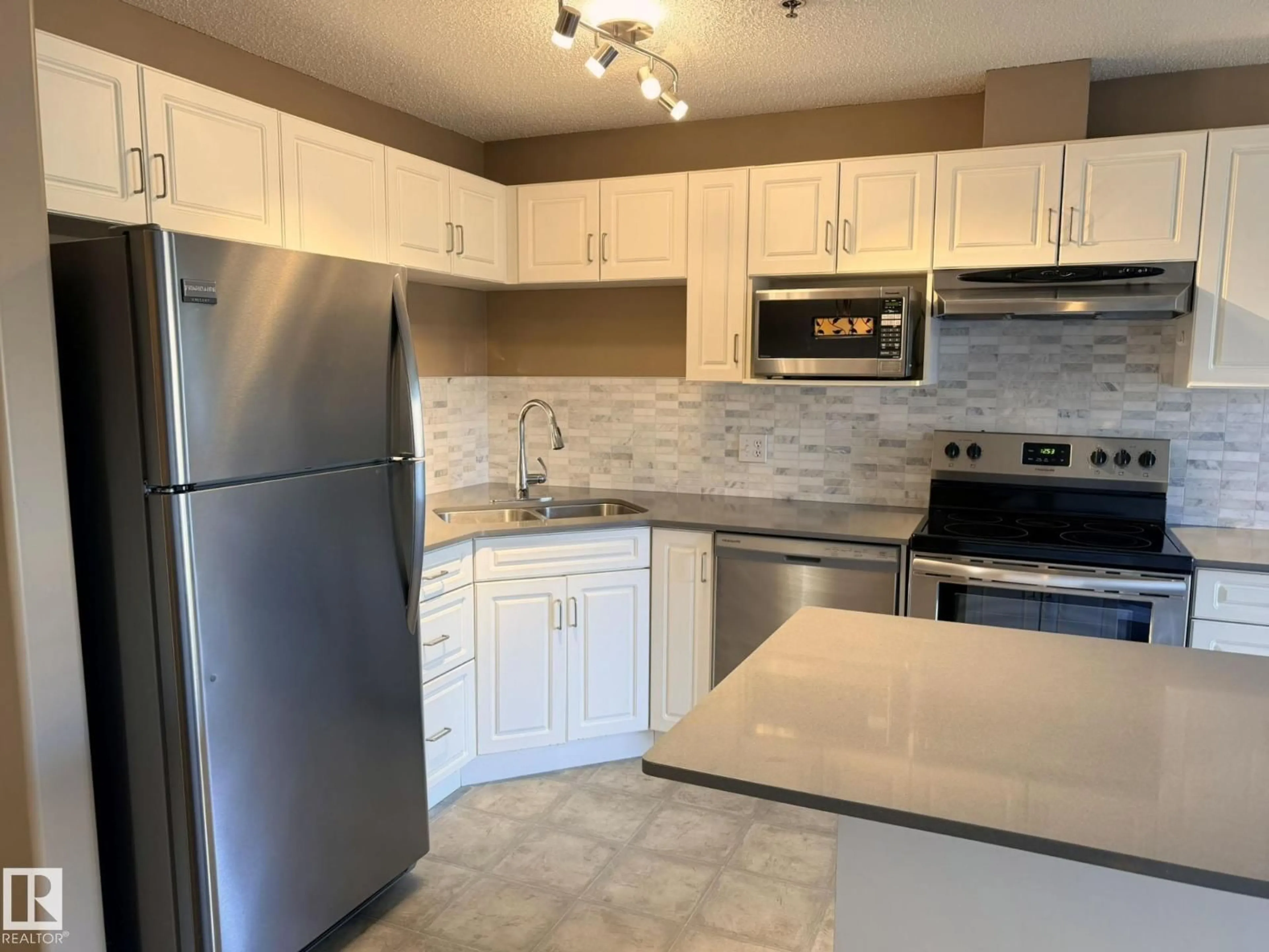 Standard kitchen, ceramic/tile floor for #227 - 2305 35A AV, Edmonton Alberta T6T1Z2