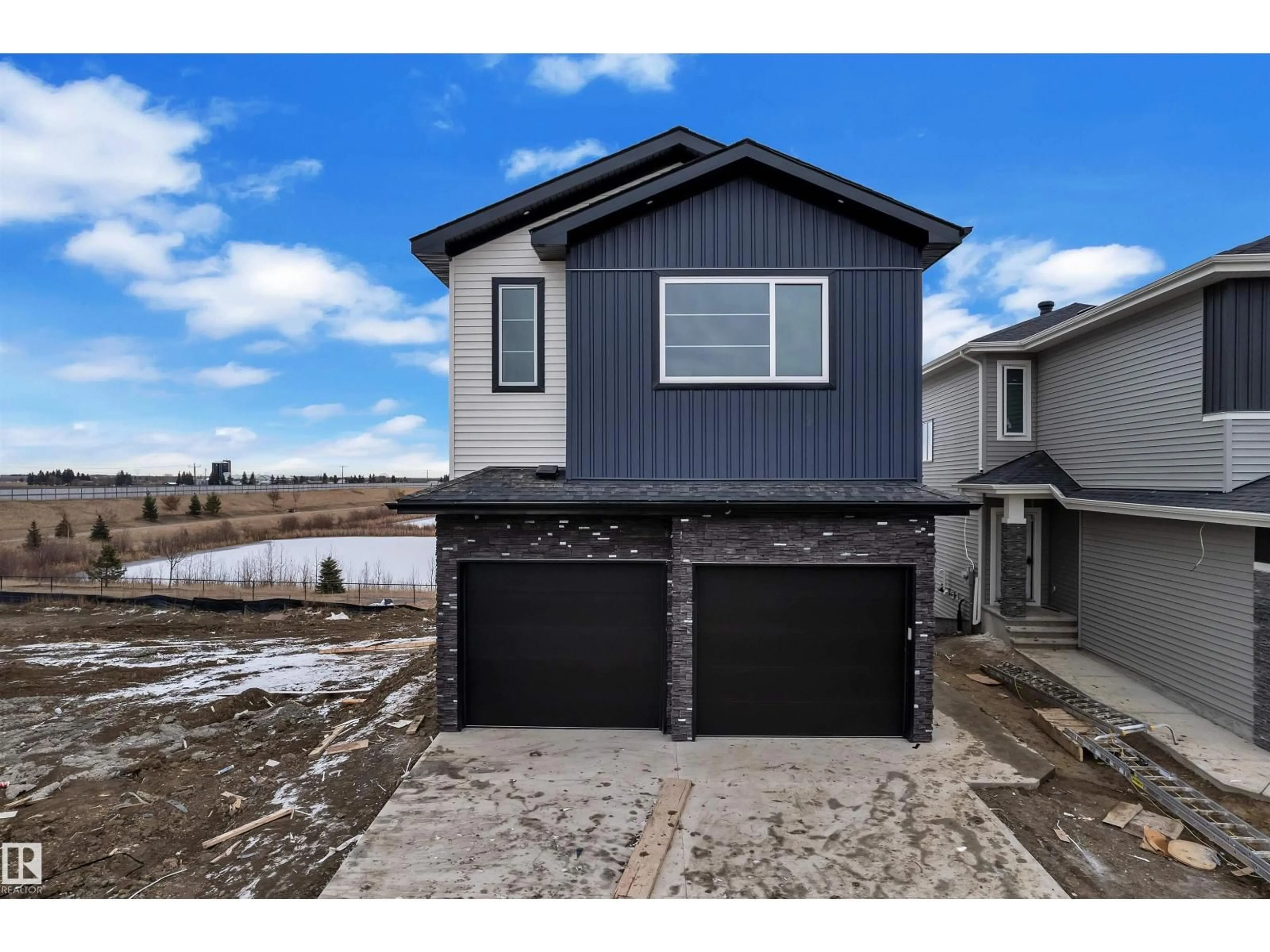 Home with vinyl exterior material, water/lake/river/ocean view for 21 AXELWOOD CR, Spruce Grove Alberta T7X3C6