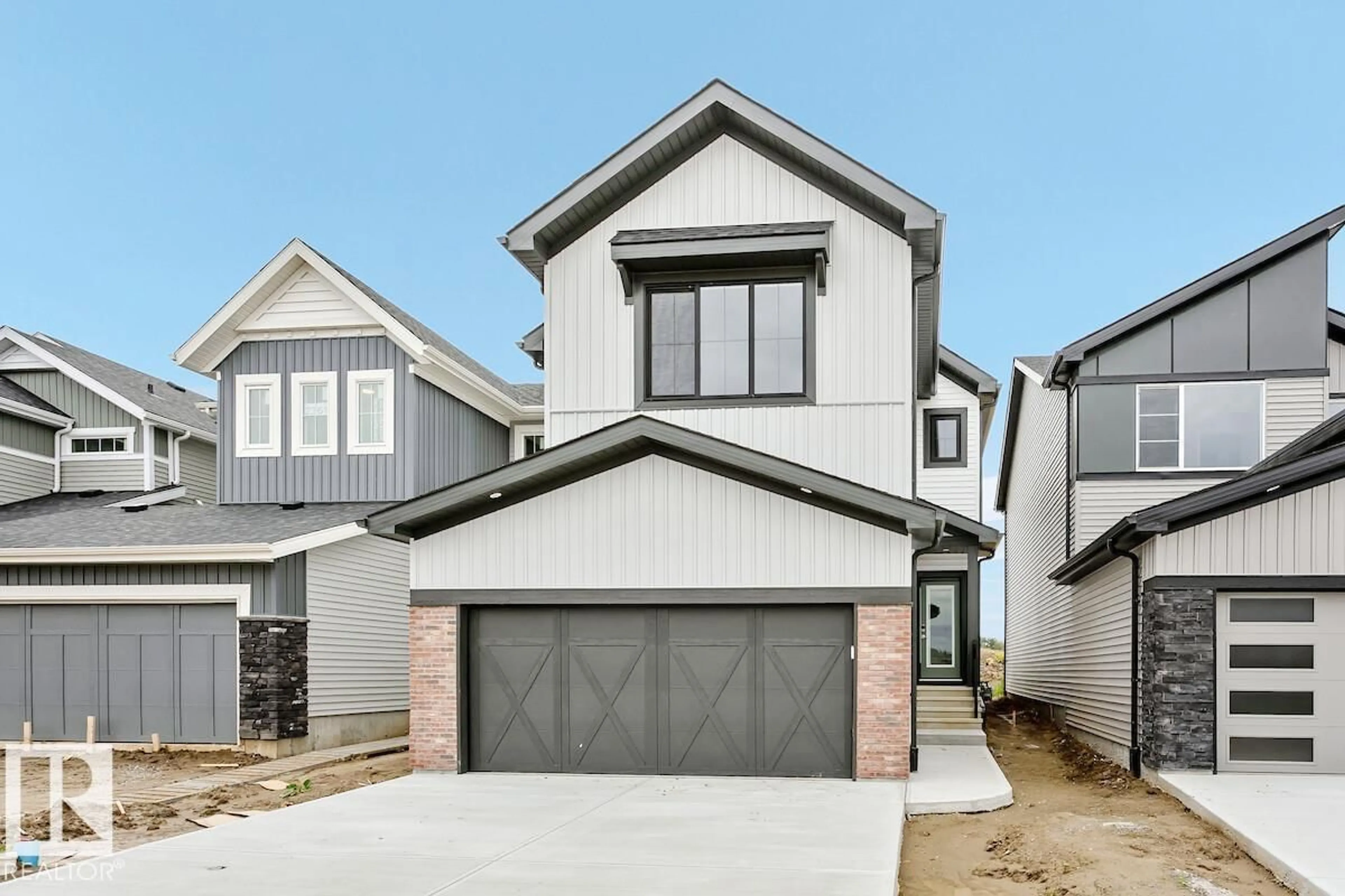 Home with vinyl exterior material, street for 2363 EGRET WY, Edmonton Alberta T6M3G8