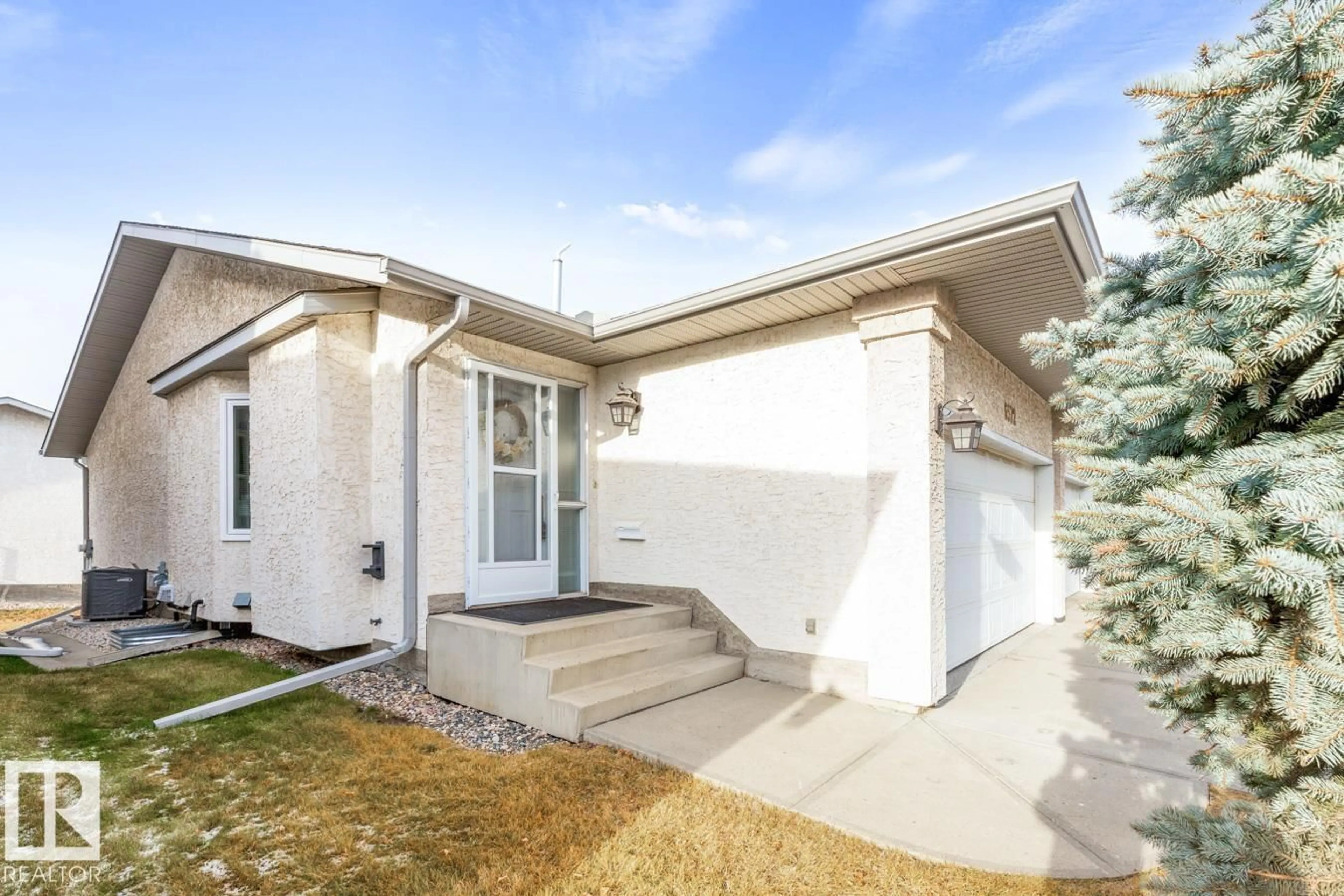 Home with vinyl exterior material, street for 6572 158 AV, Edmonton Alberta T5Y2S7